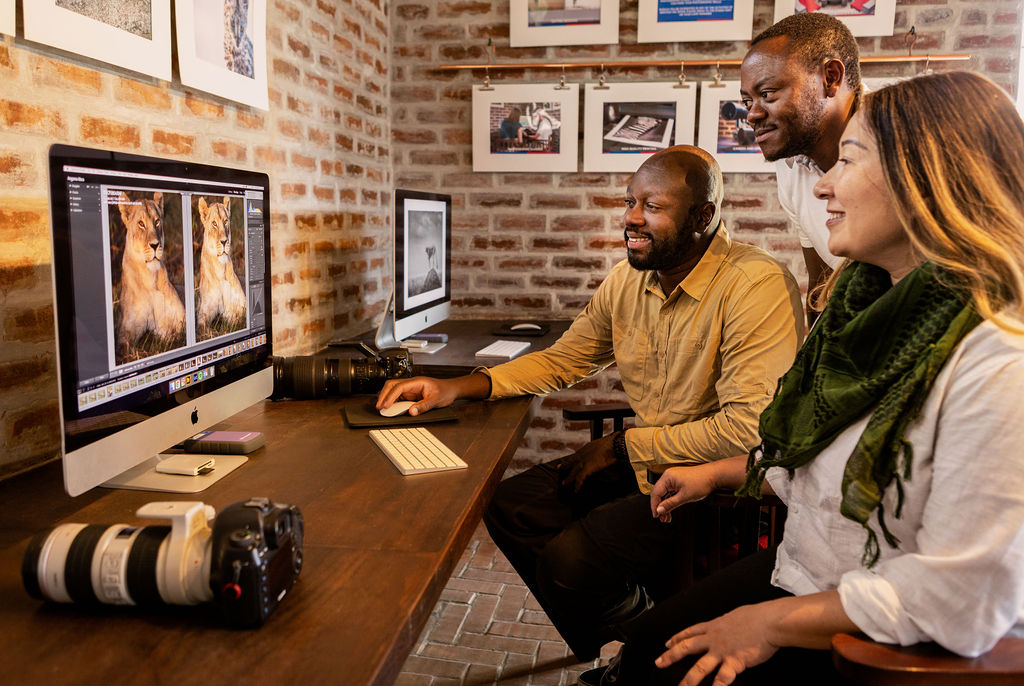 guests working in the photography lab of Angama Mara Kenya Masai Mara