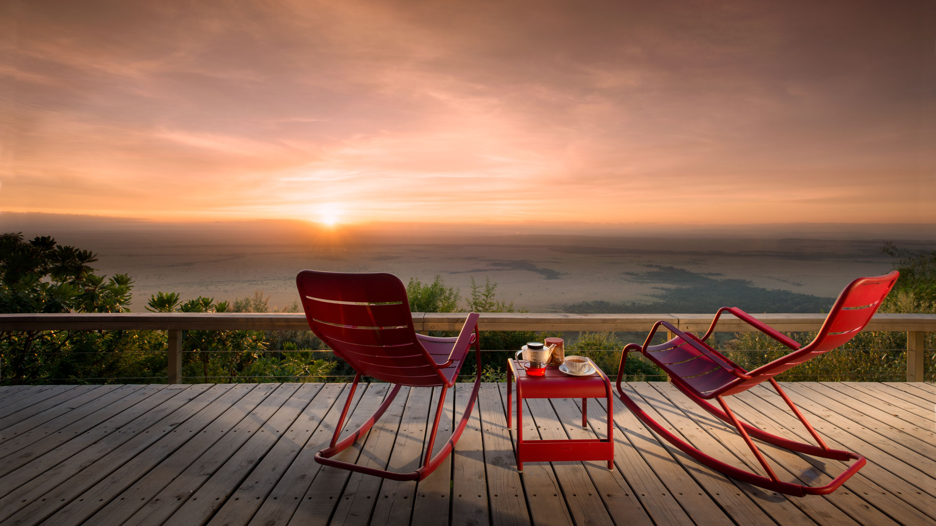 red rocking chairs on the deck of Angama Mara Kenya Masai Mara