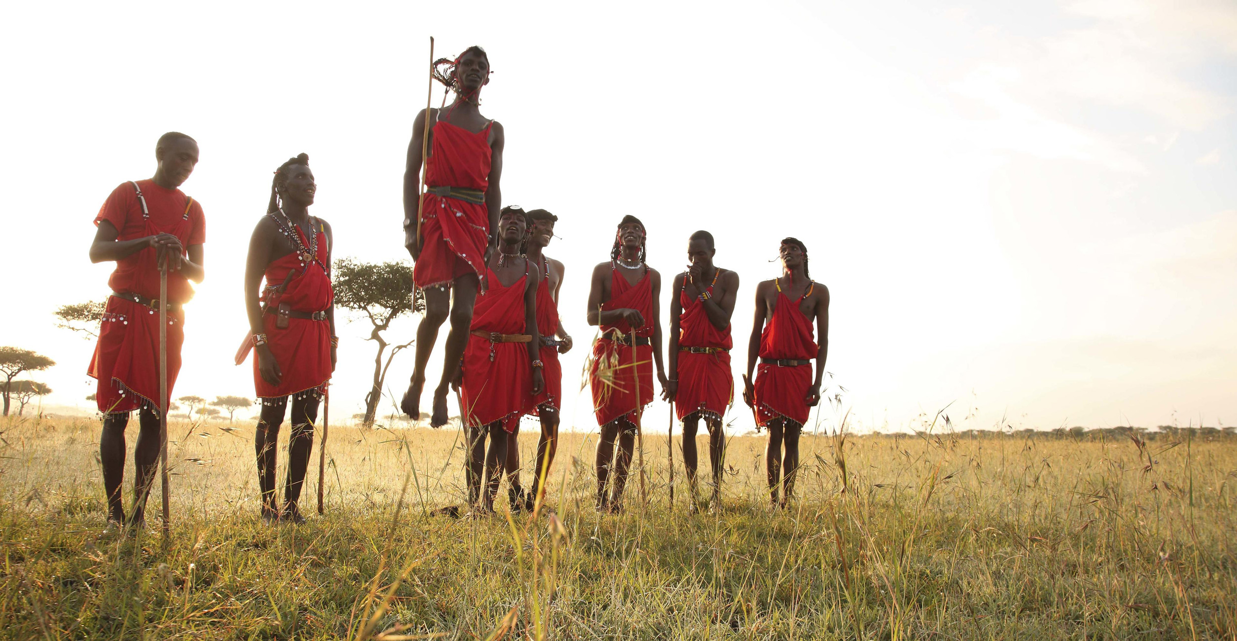 Masai men preforming ritual dance at andbeyond Bateleur camp Kenya Masai Mara