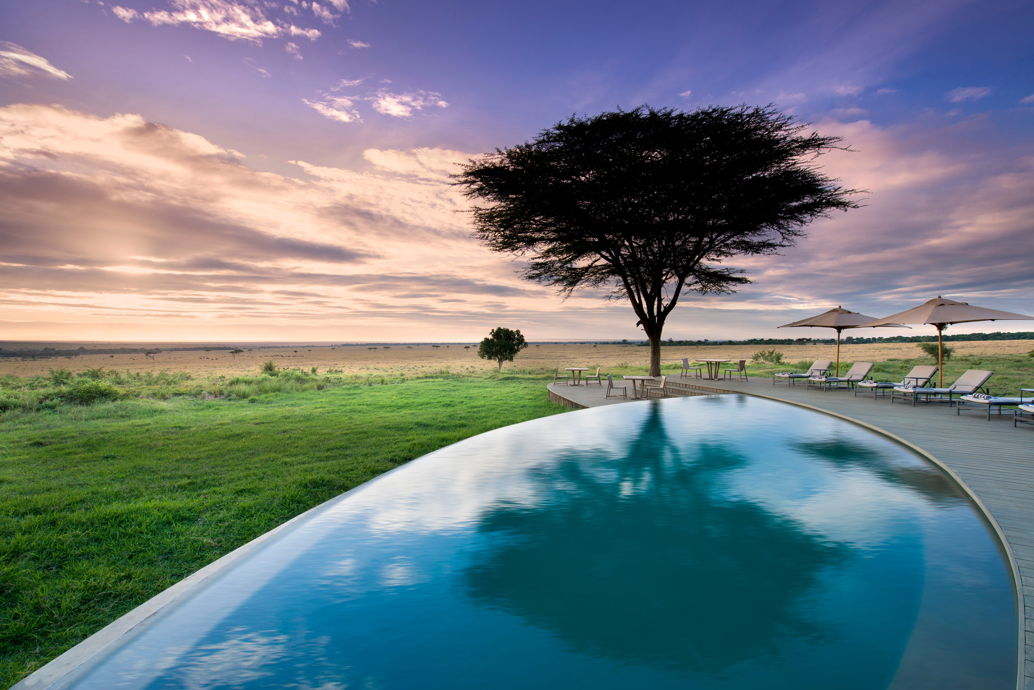 view of pool and deck at andbeyond Bateleur camp Kenya Masai Mara