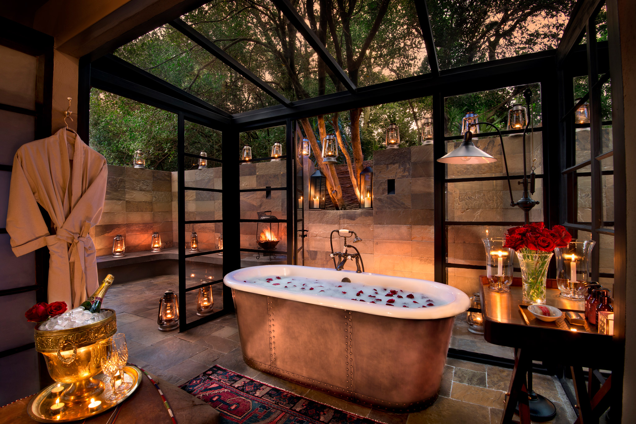 copper bathtub in open window bathroom of a suite at andbeyond Bateleur camp Kenya Masai Mara