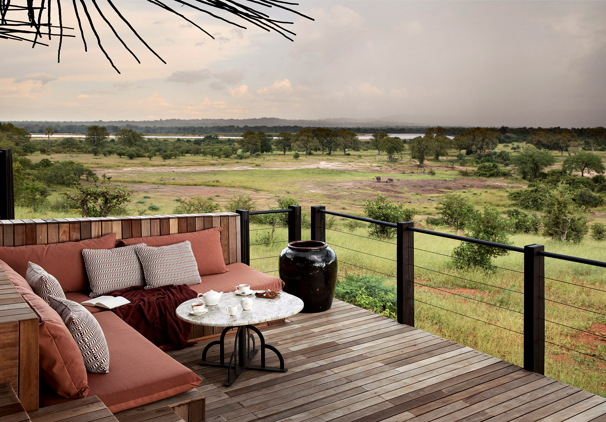 view from the deck of a suite overlooking plains at Chichele Presidential Lodge Zambia