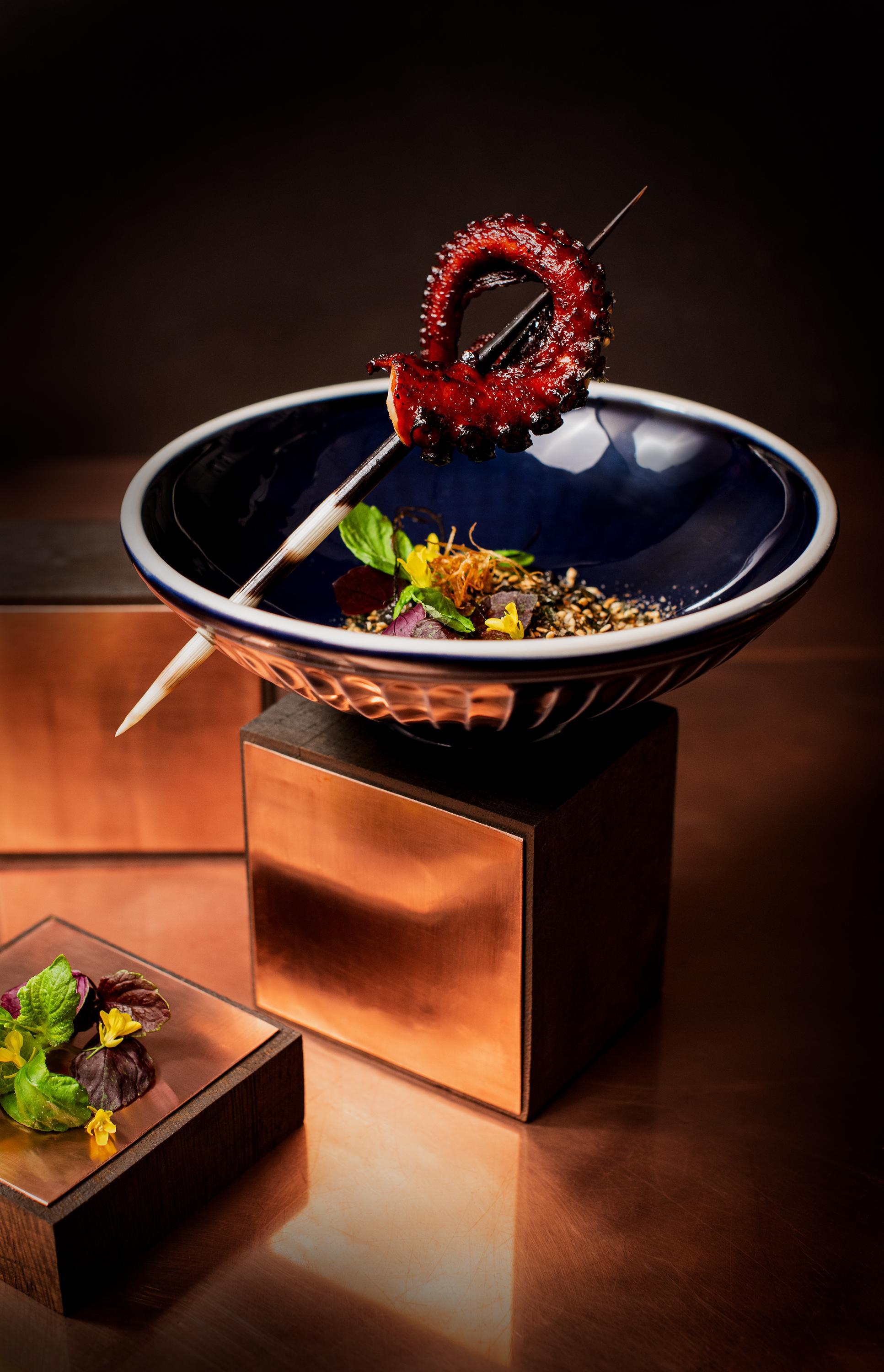 octopus japanese gourmet dish served on copper pedestal at delaire graff restaurant