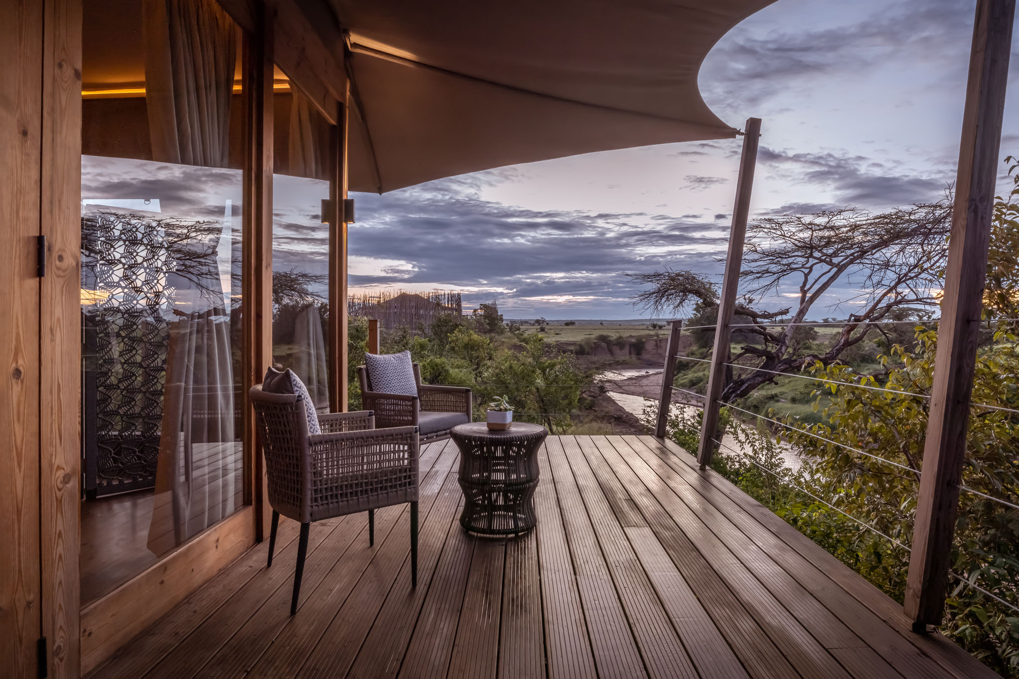 exterior deck at sunset of aking suite at the JW Marriot Masai Mara Kenya