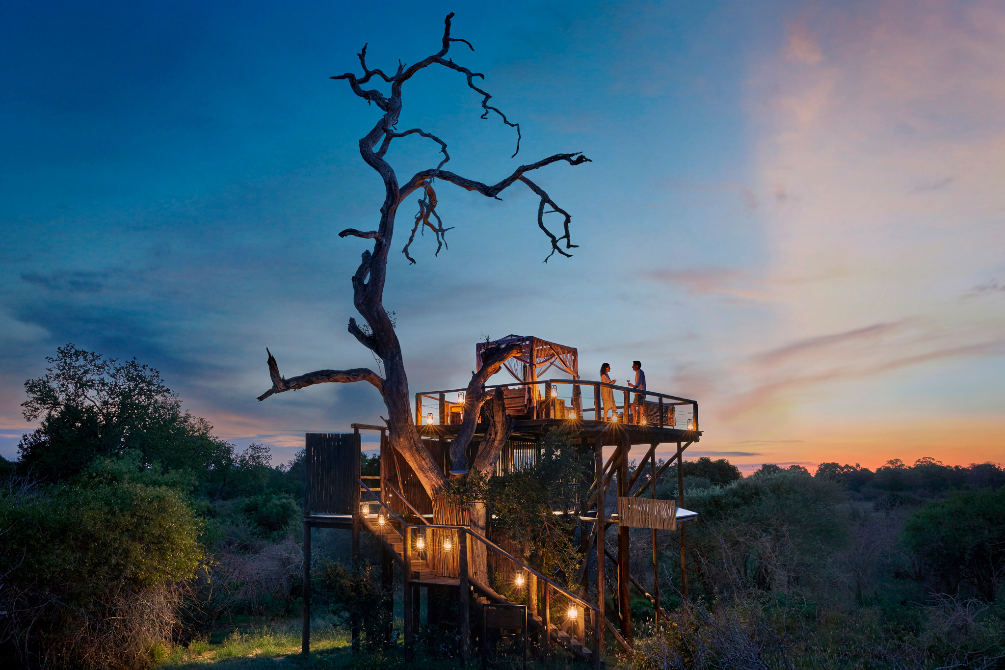 view of Chalkey Treehouse at night by Lion Sands Game Reserve