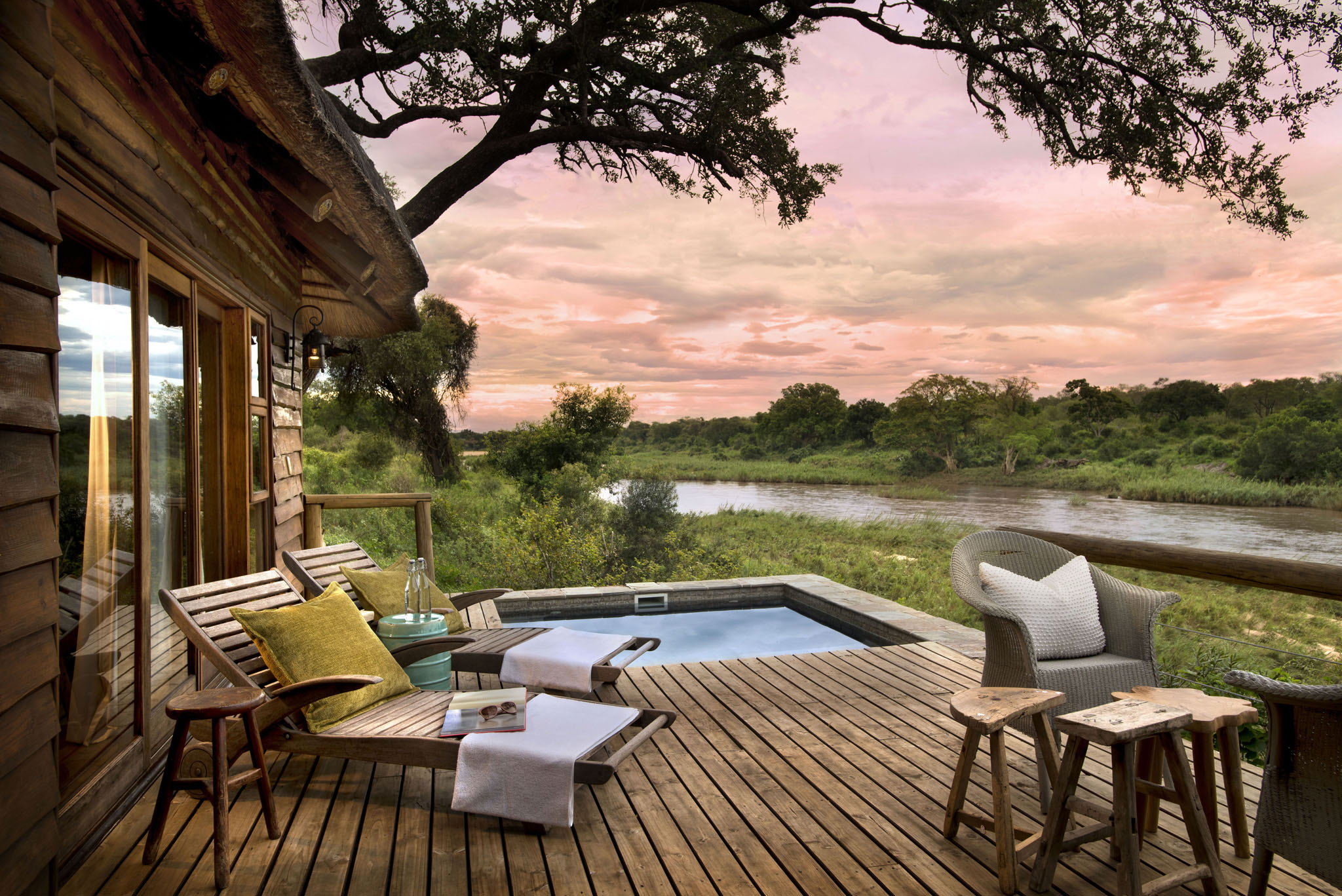 splash pool on deck at sunset by Nerina lodge lion sands