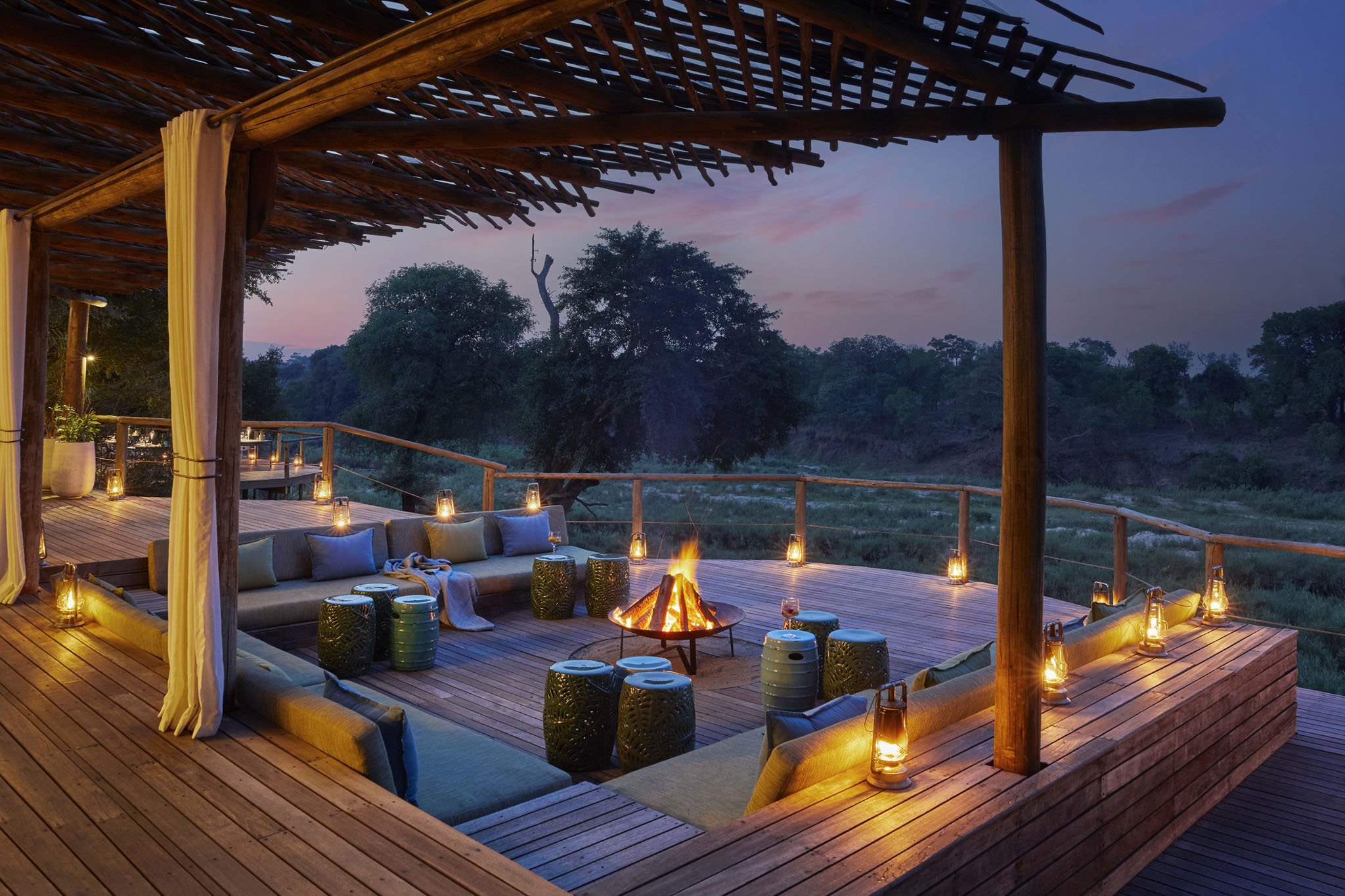 Nerina lodge fire deck at night by lion sands