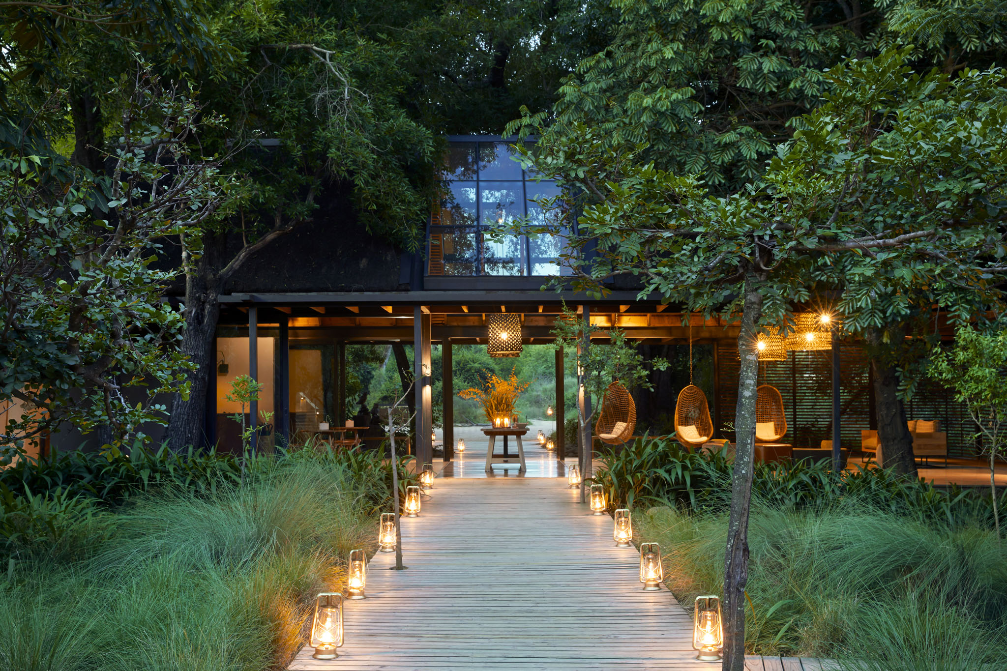 entrance walkway of lion sands river lodge at night