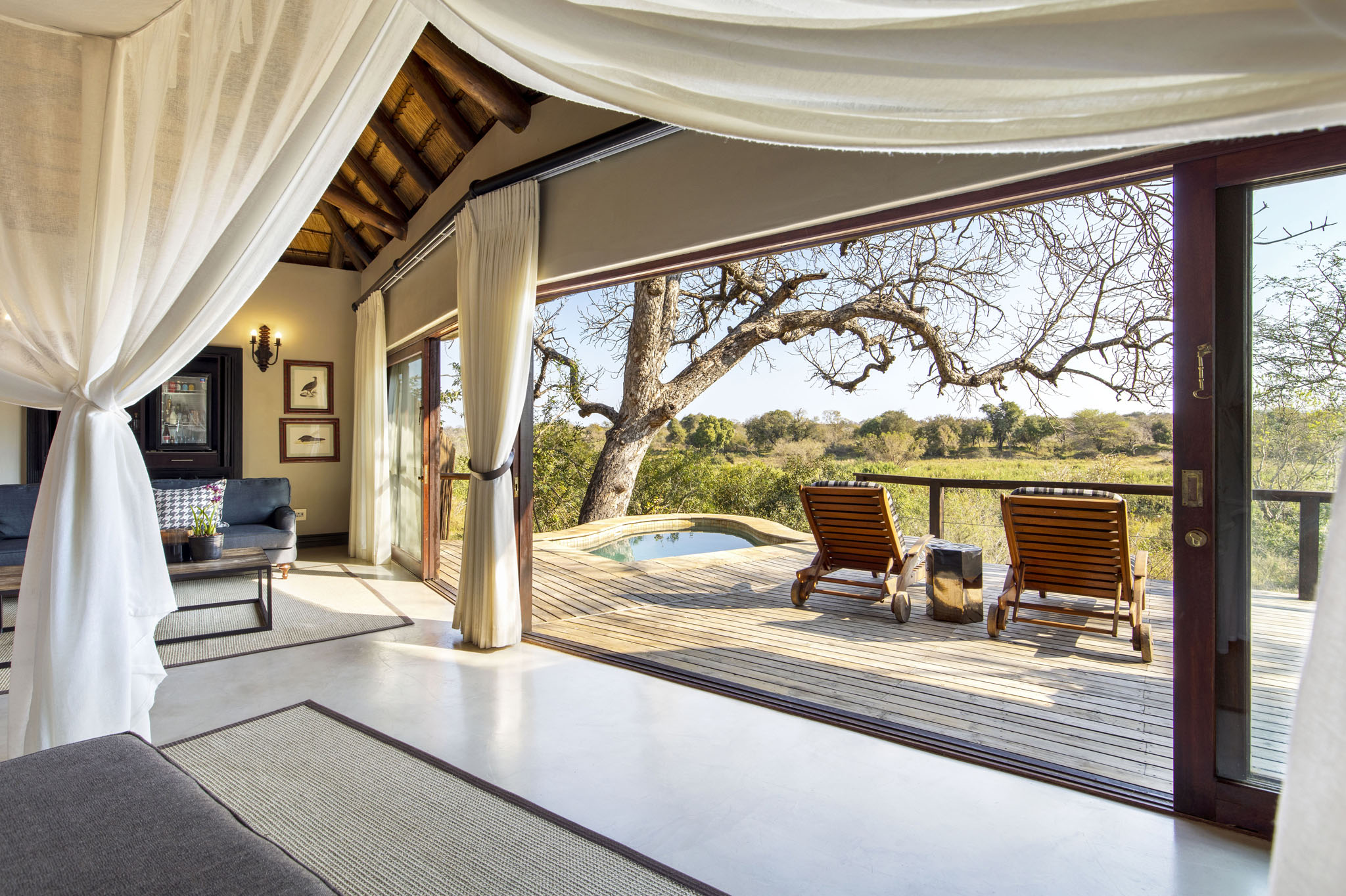 view of bedroom and deck at tinga lodge lion sands