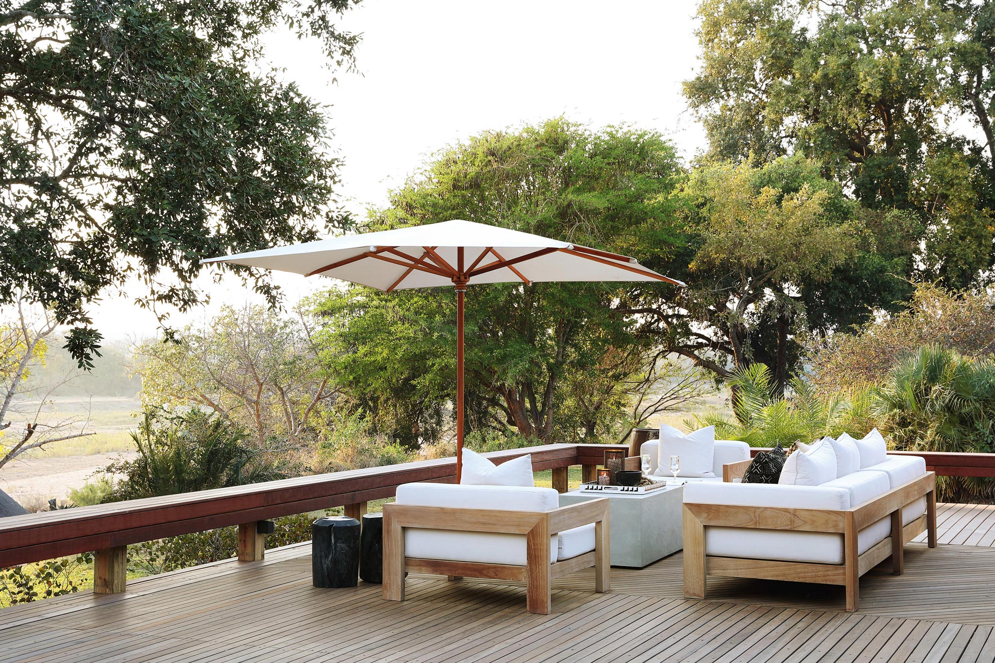 deck with couches and table by main lodge malamala