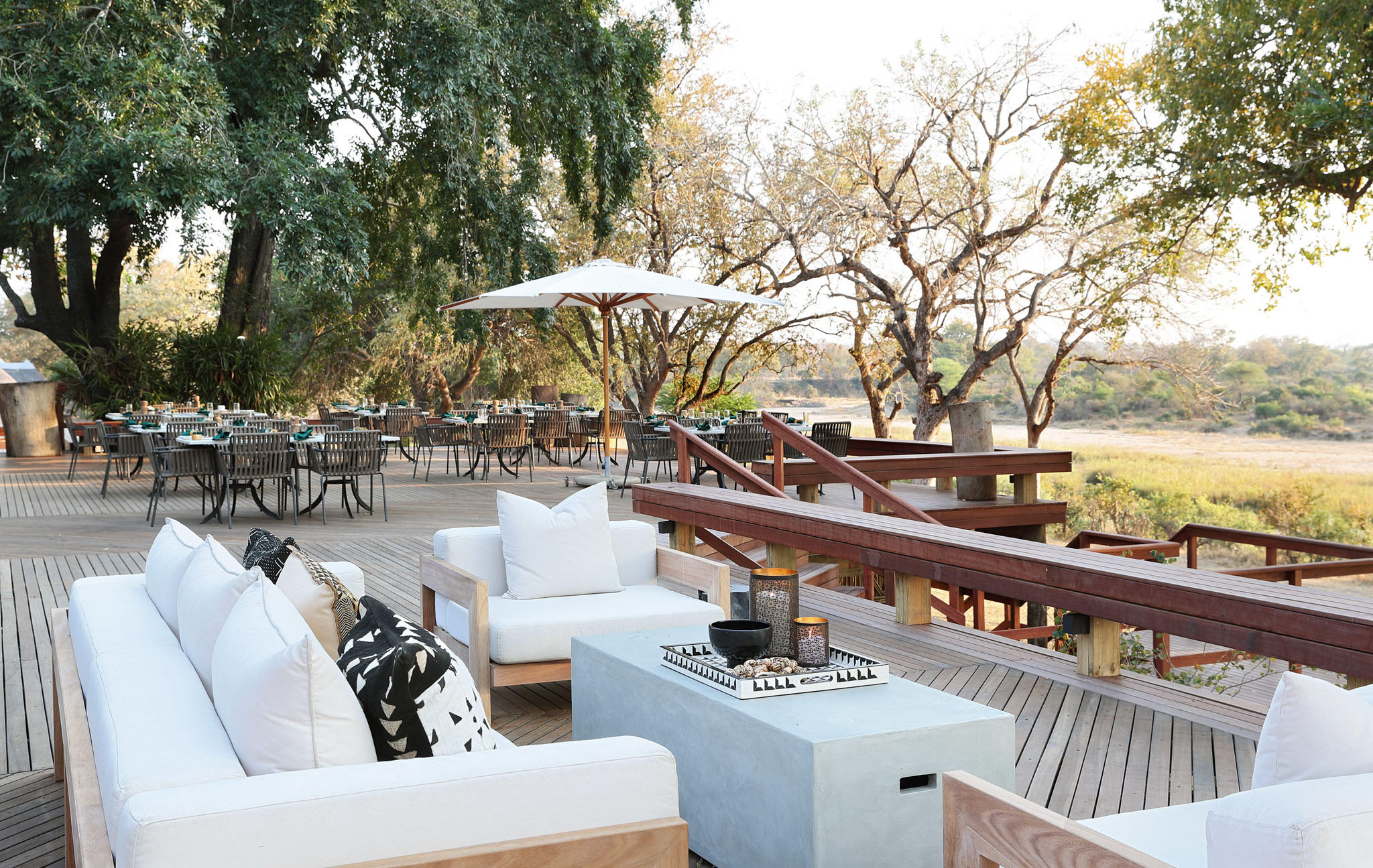 deck with couches and table by main lodge MalaMala