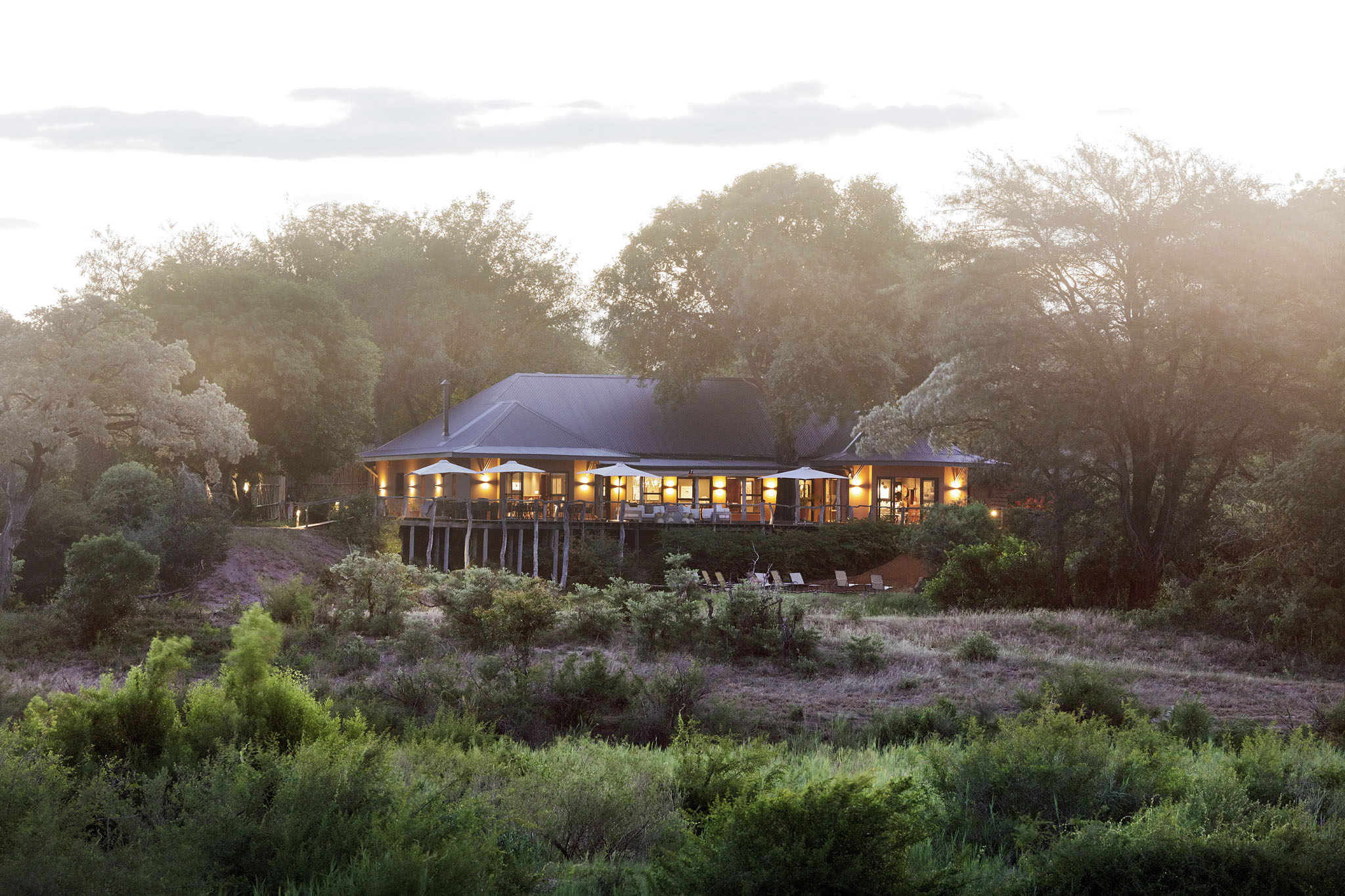 evening exterior view of sable camp at MalaMala