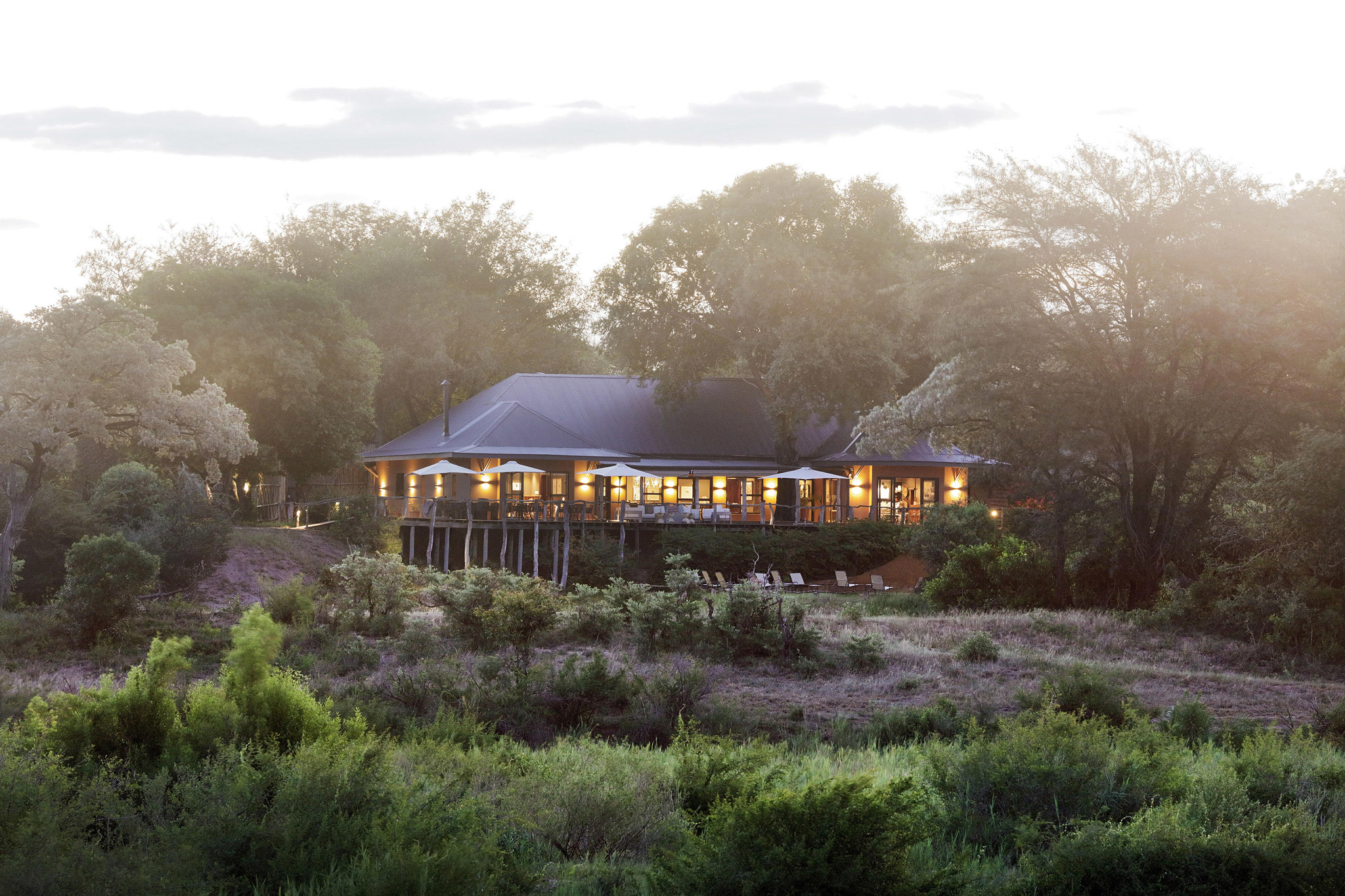 exterior view from river of main lodge at Sable Camp Malamala game reserve