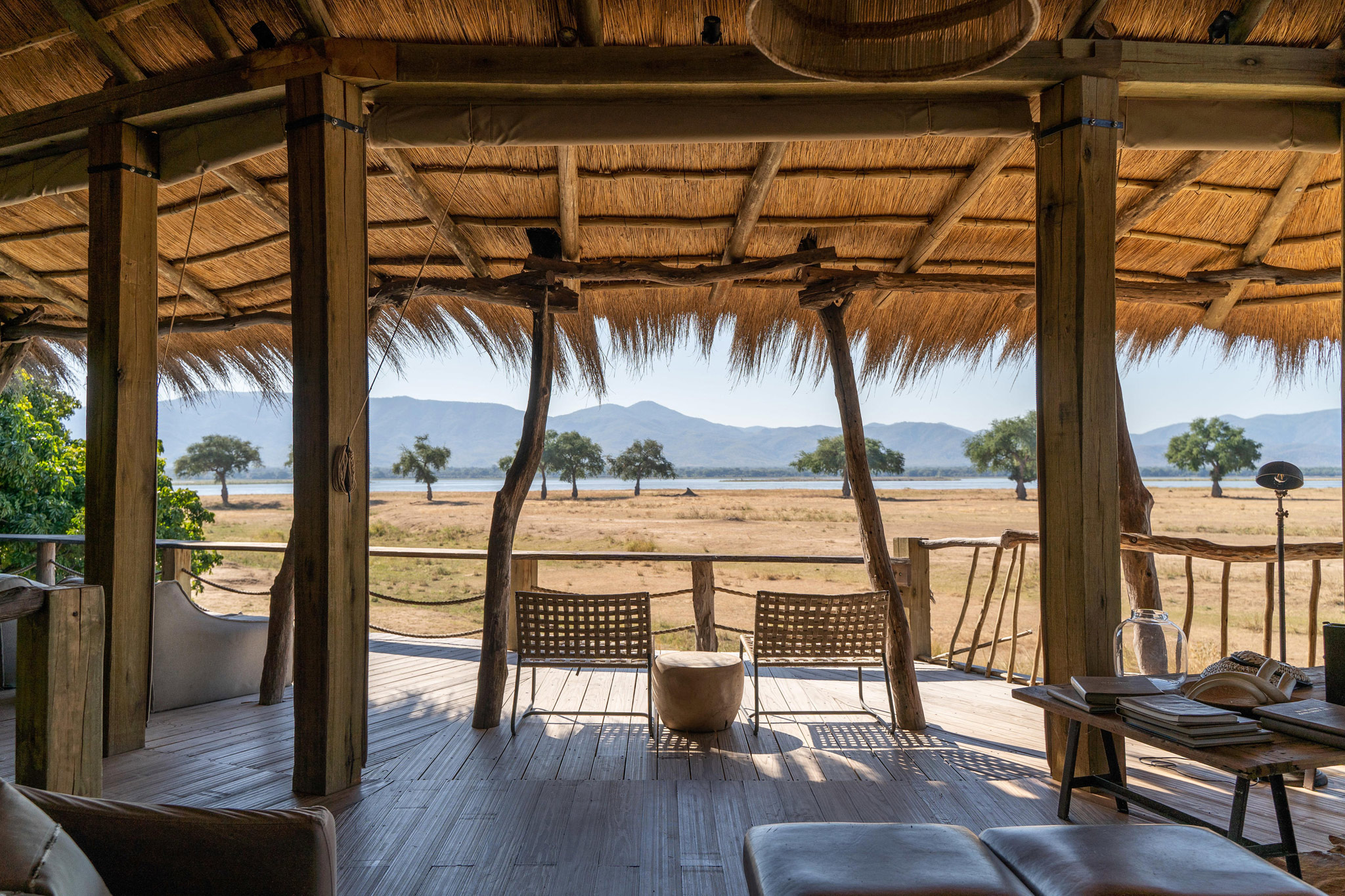 loungers on viewing deck of main camp Nyamatusi Camps Mana Pools Zimbabwe 