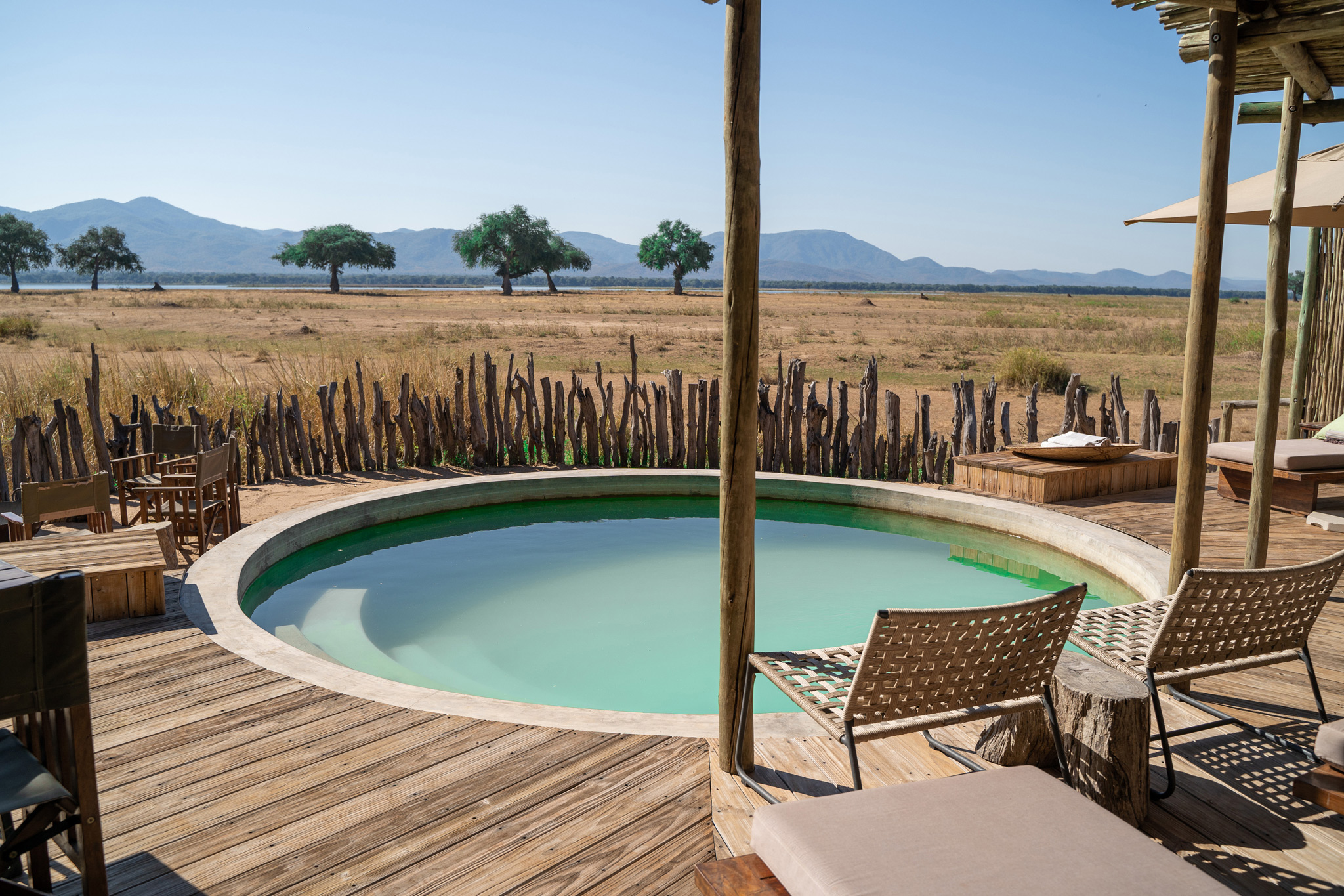 deck and loungers by pool with views at Nyamatusi Camps Mana Pools Zimbabwe 