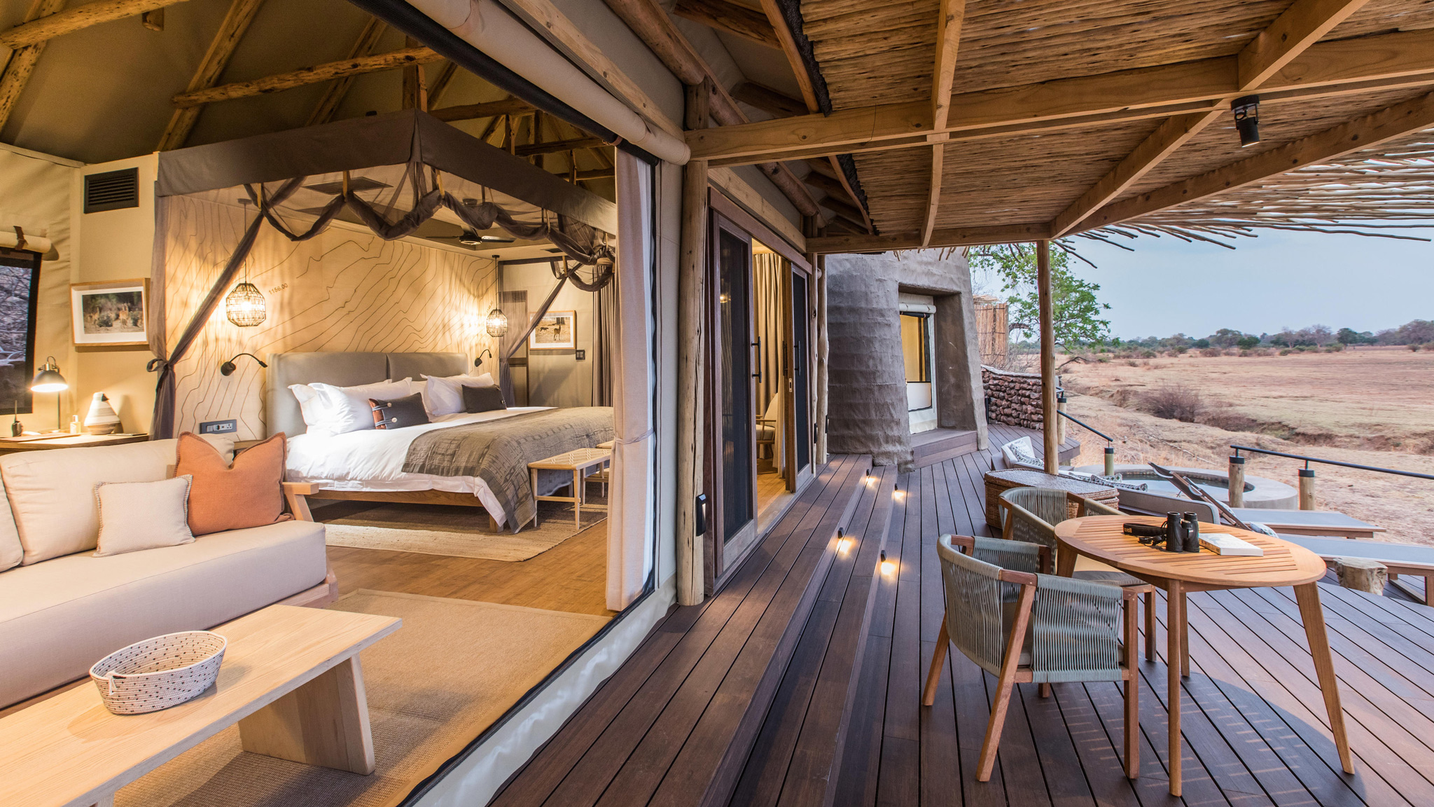 partial view of room and deck with pool at suite of Puku Ridge Camp Zambia