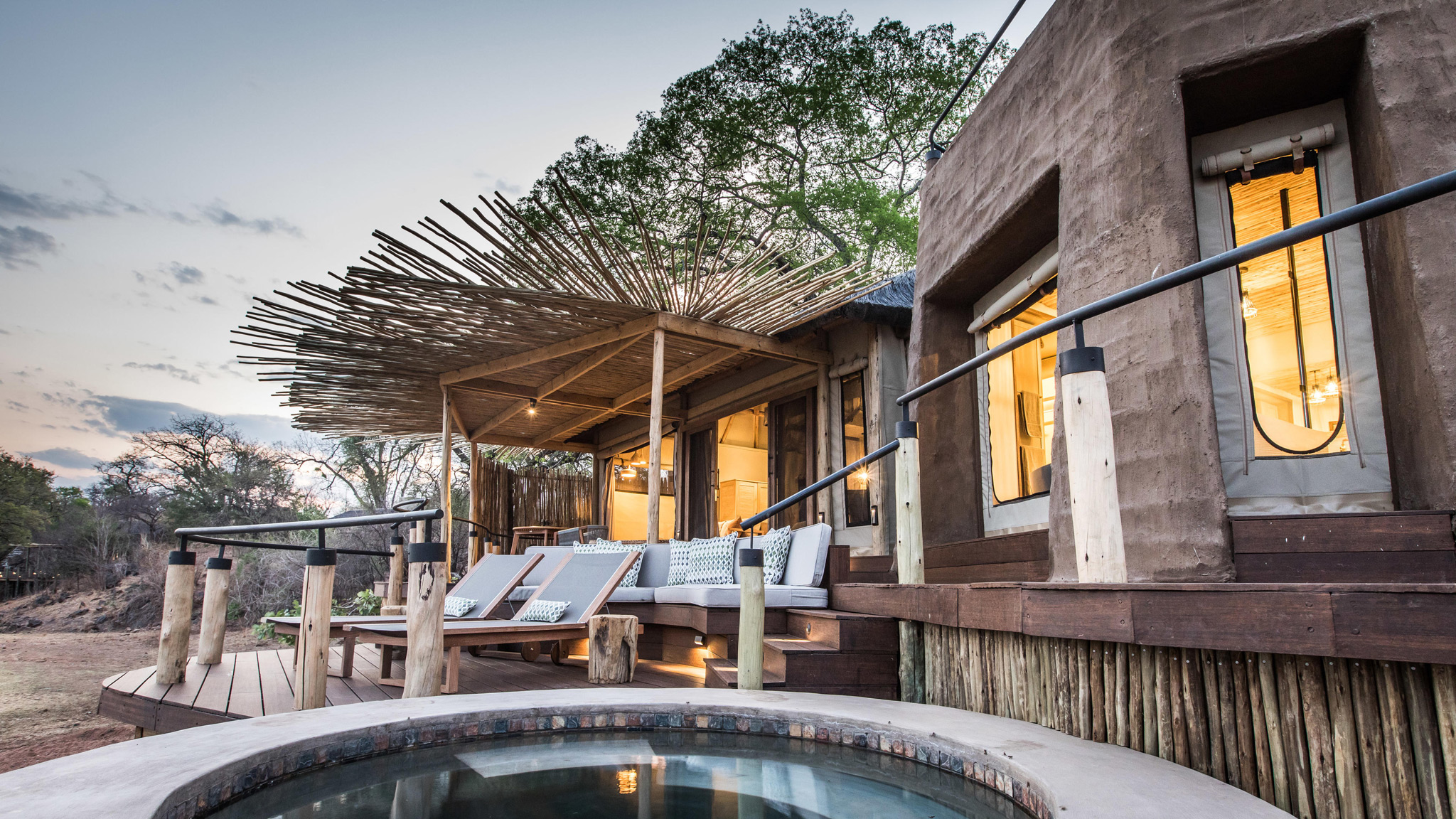 exterior view of tented suite with deck and pool by Puku Ridge Camp Zambia