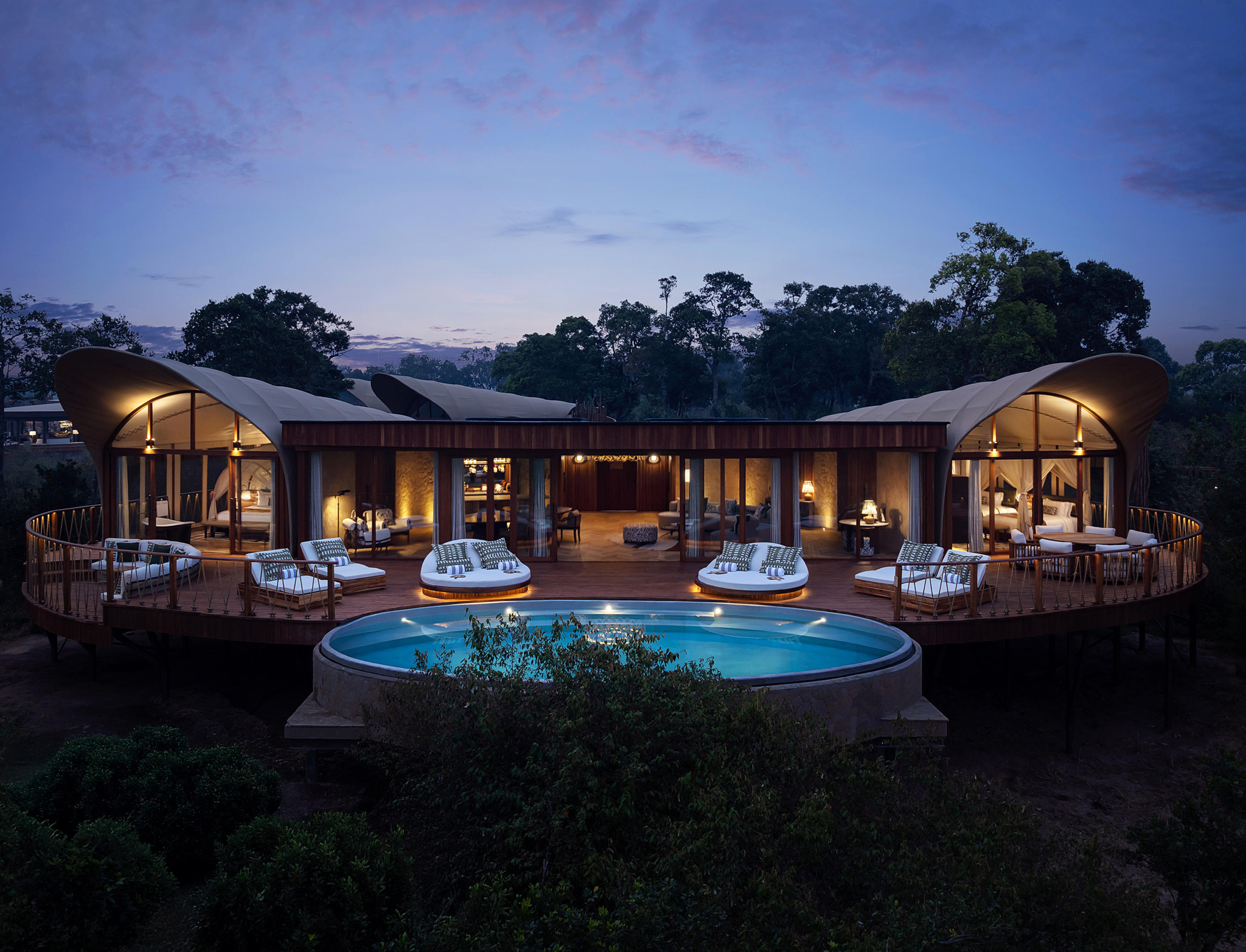 pool view and room exterior of a presidential suite at ritz carlton masai mara