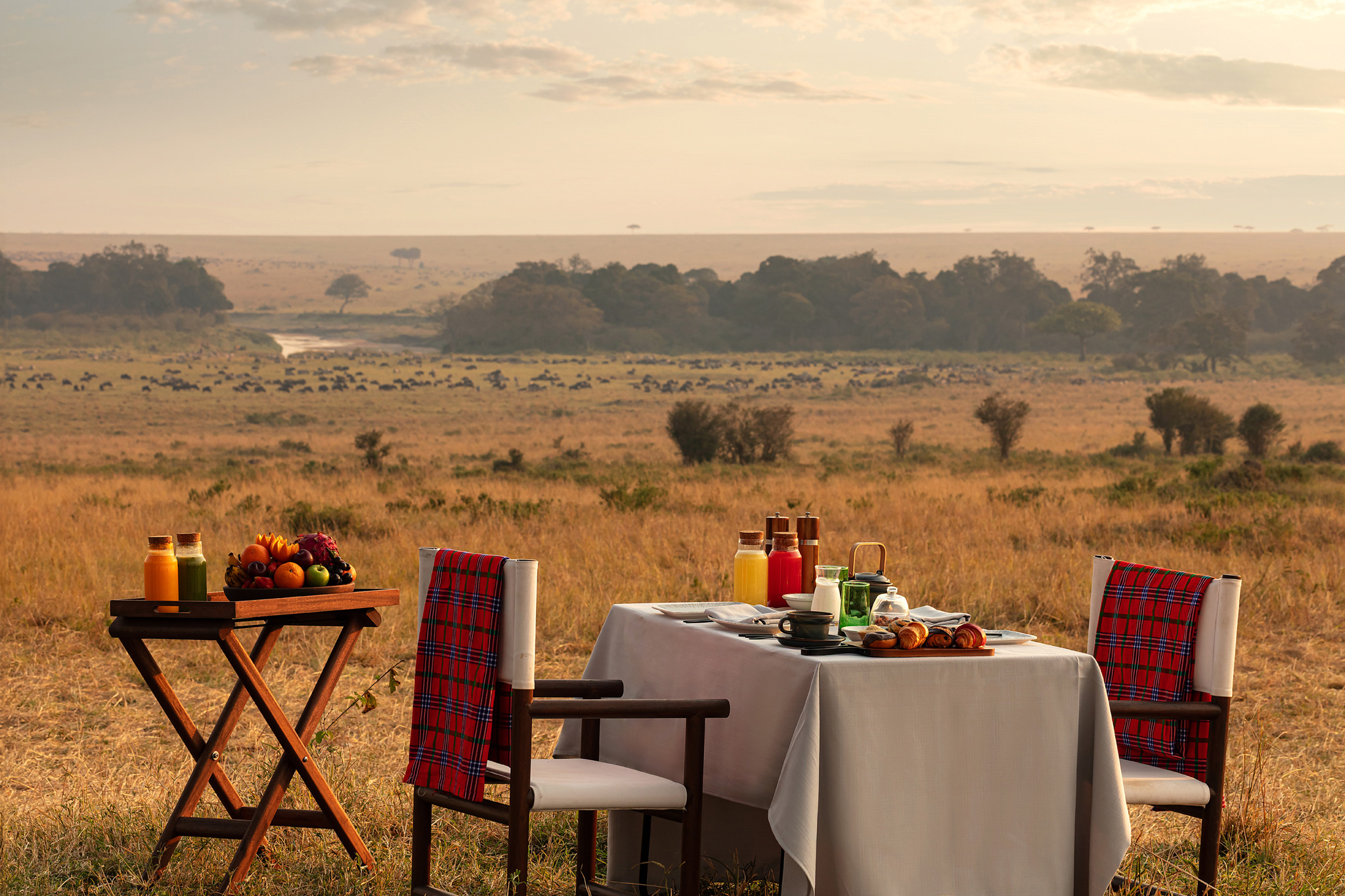 table set on the plains for a bush dinner at ritz carlton masai mara