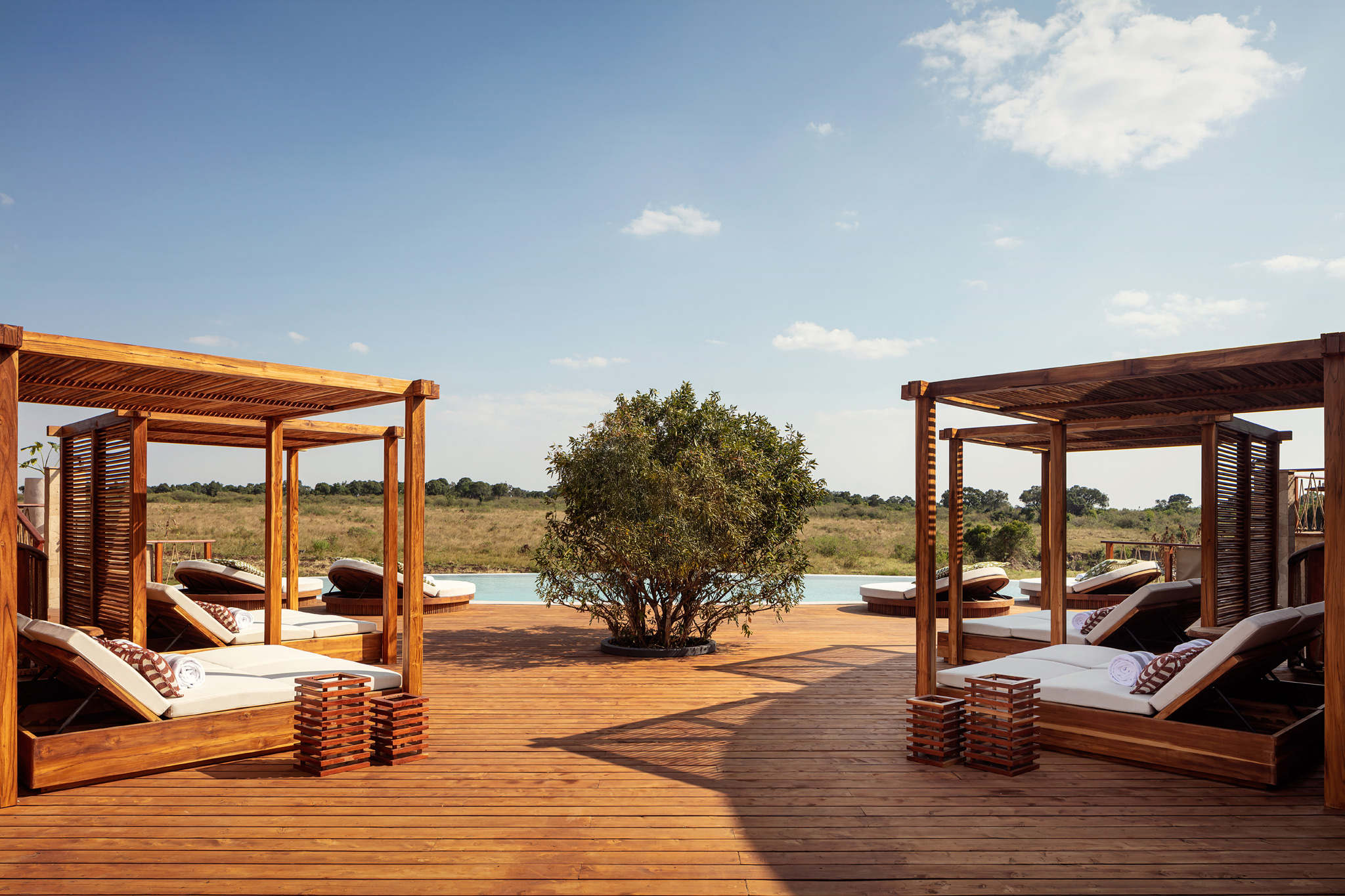 salas on deck by pool of ritz carlton masai mara