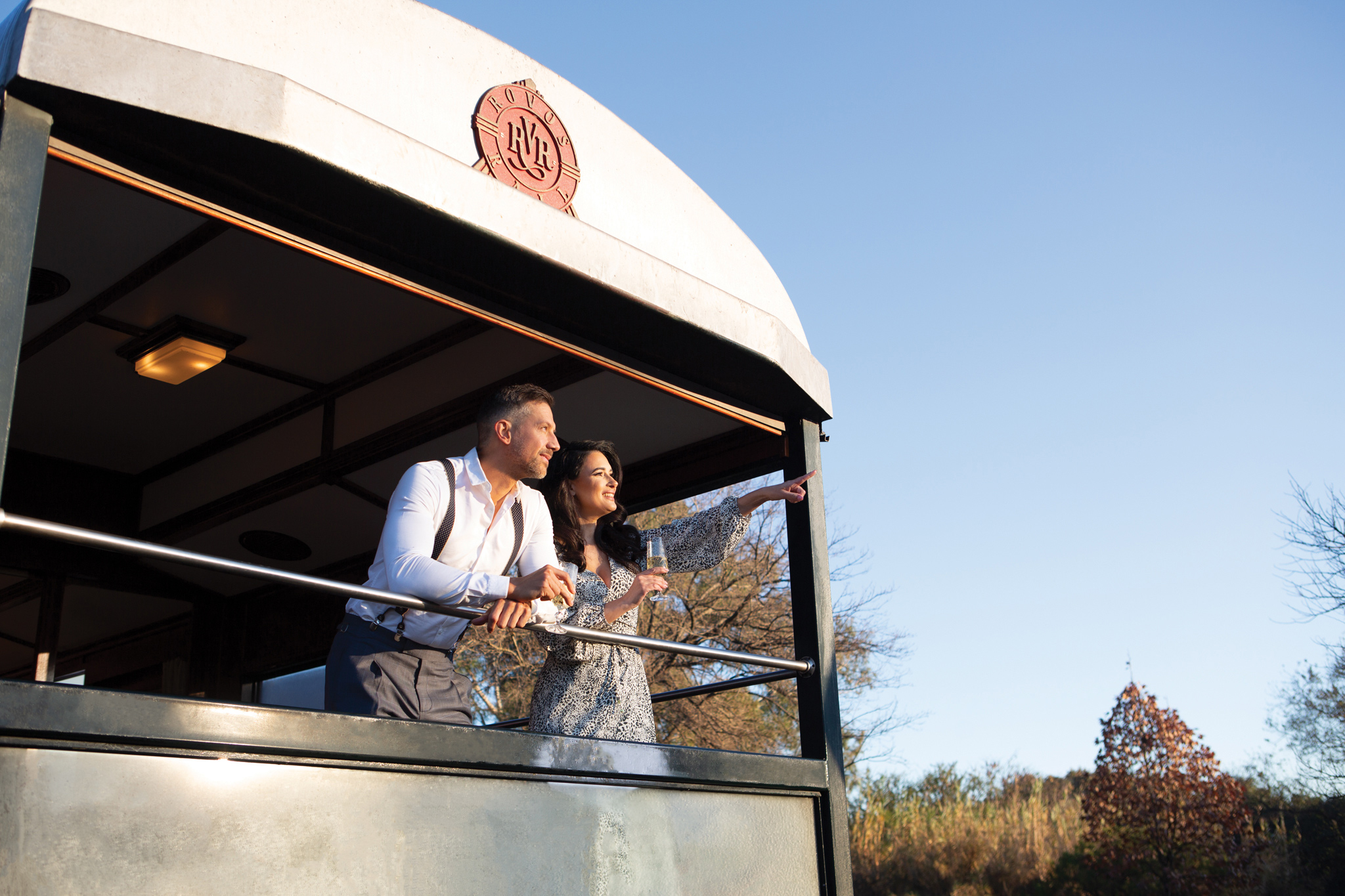 couple looking from back of observation cart of Rovos rail luxury train safaris