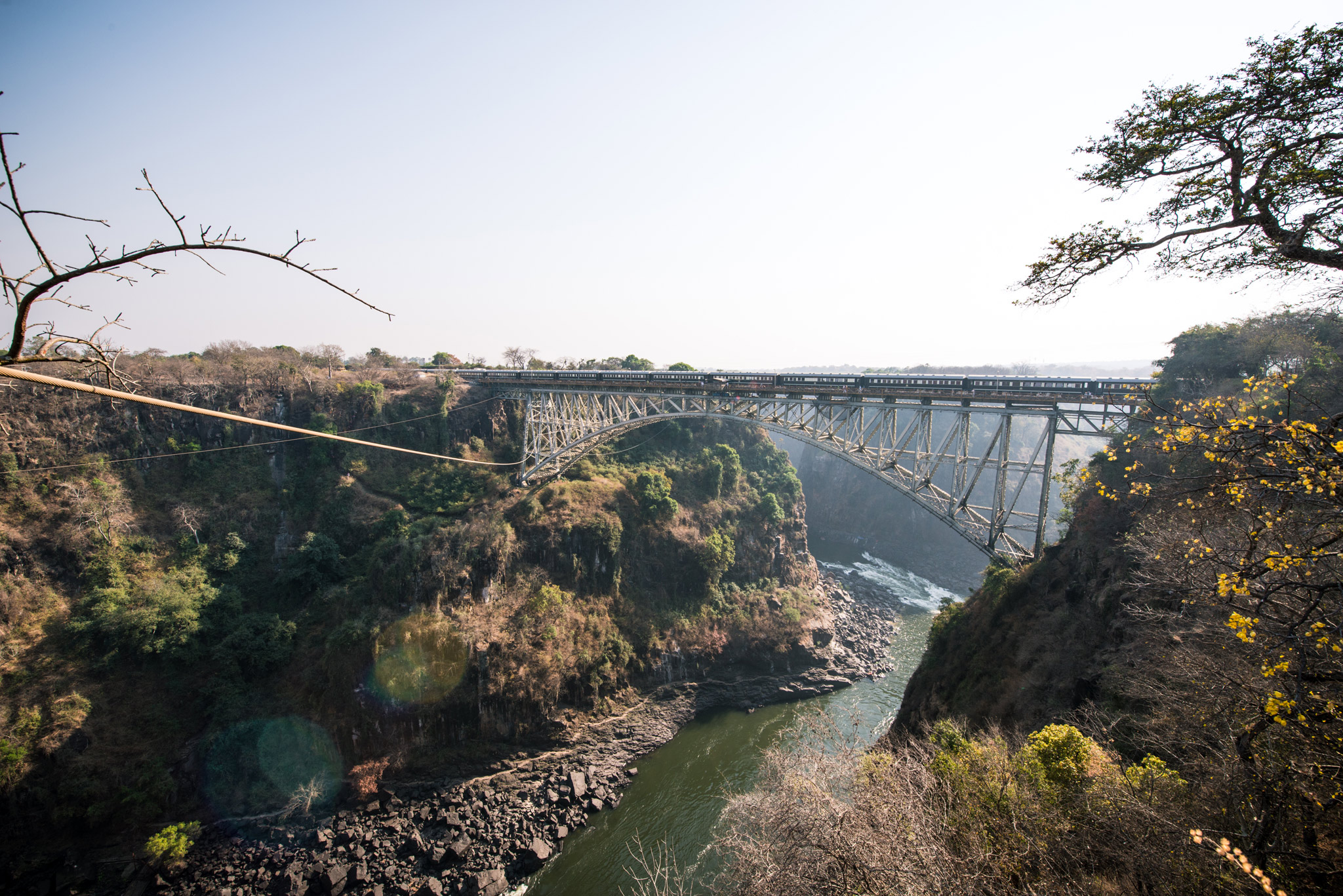 rovos rail crossing river on high bridge by victoria falls zimbabawe