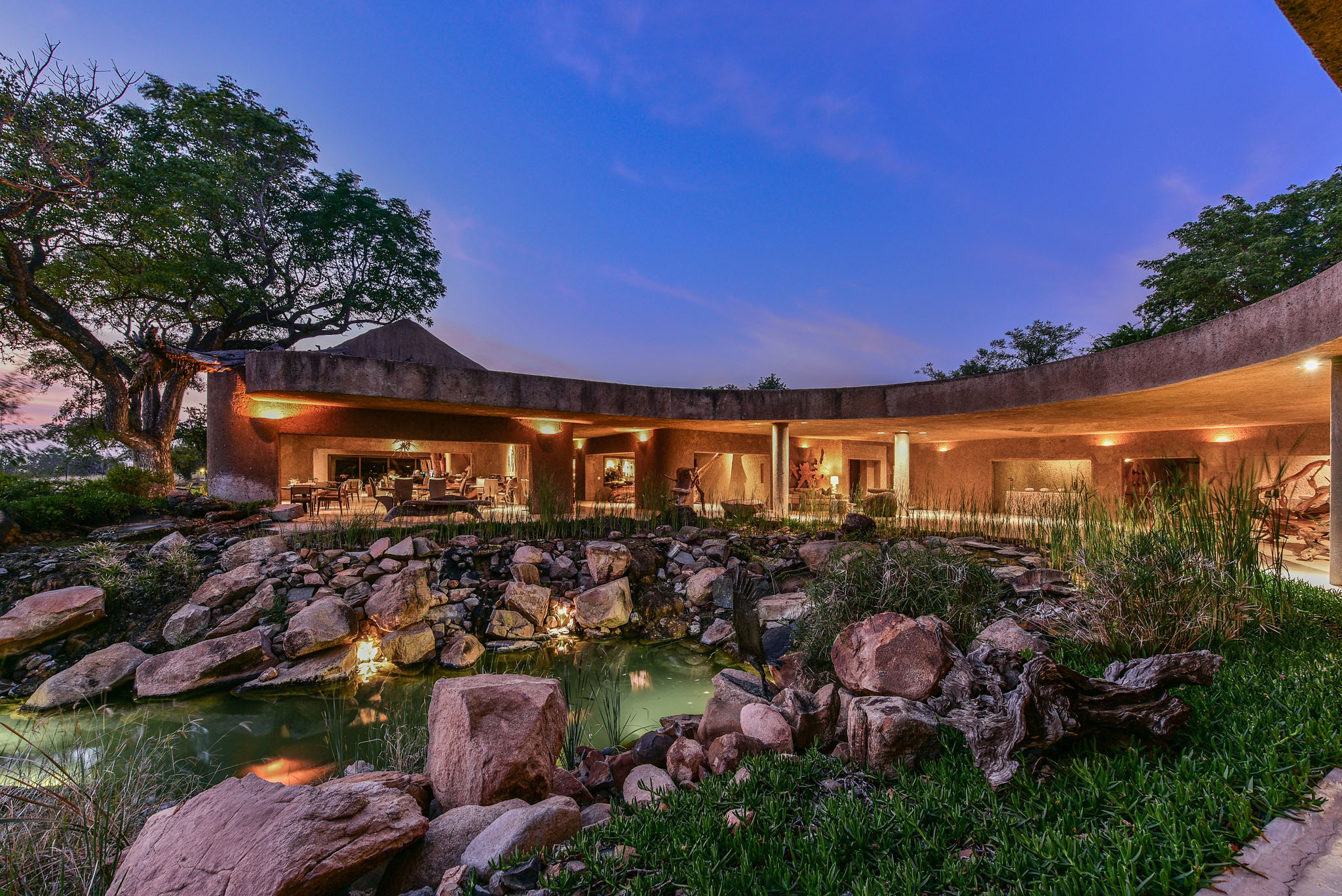view of sabi sabi earth lodge from outside at nighttime