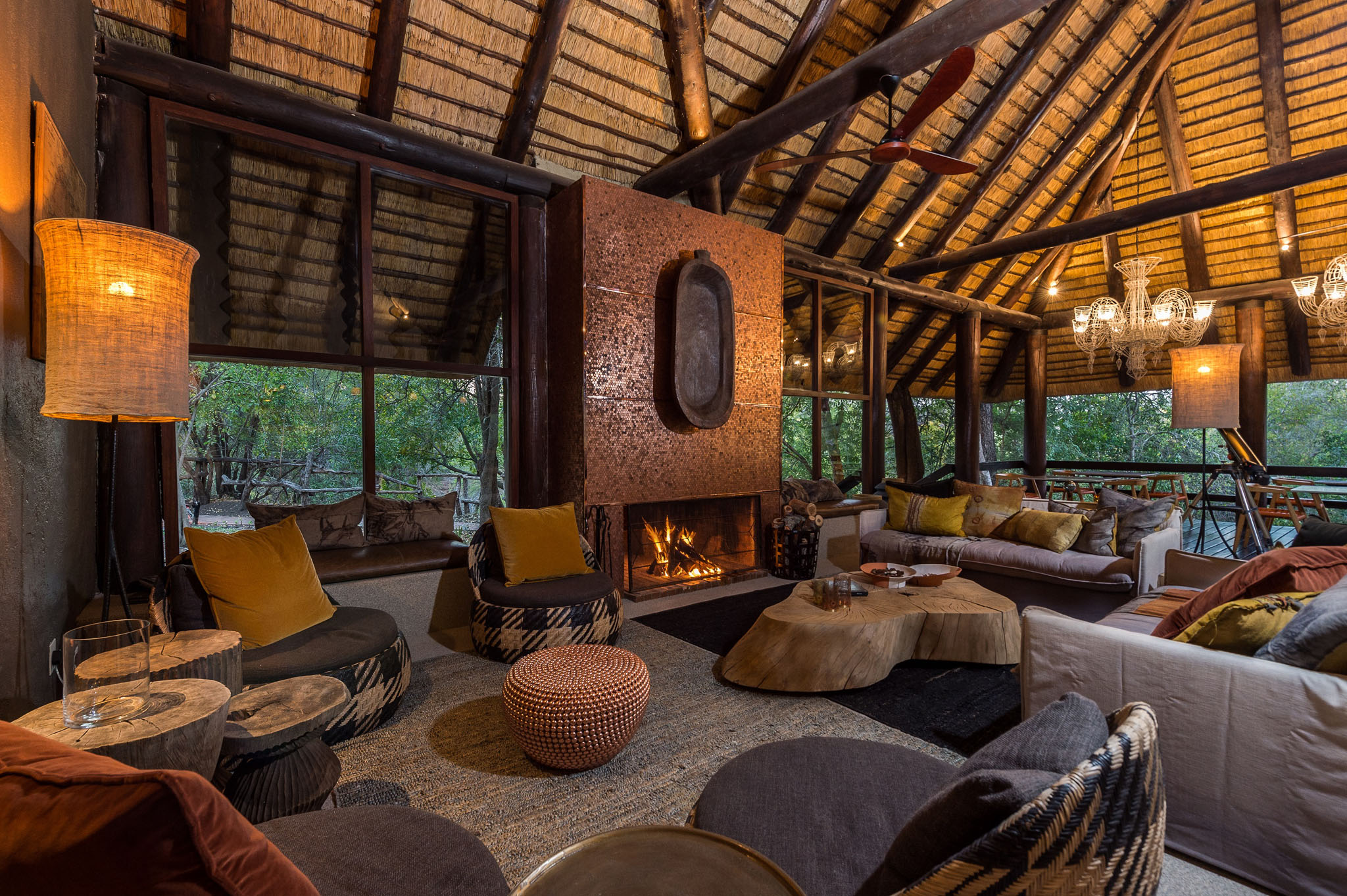 fireplace in lounge of main lodge by little bush camp sabi sabi