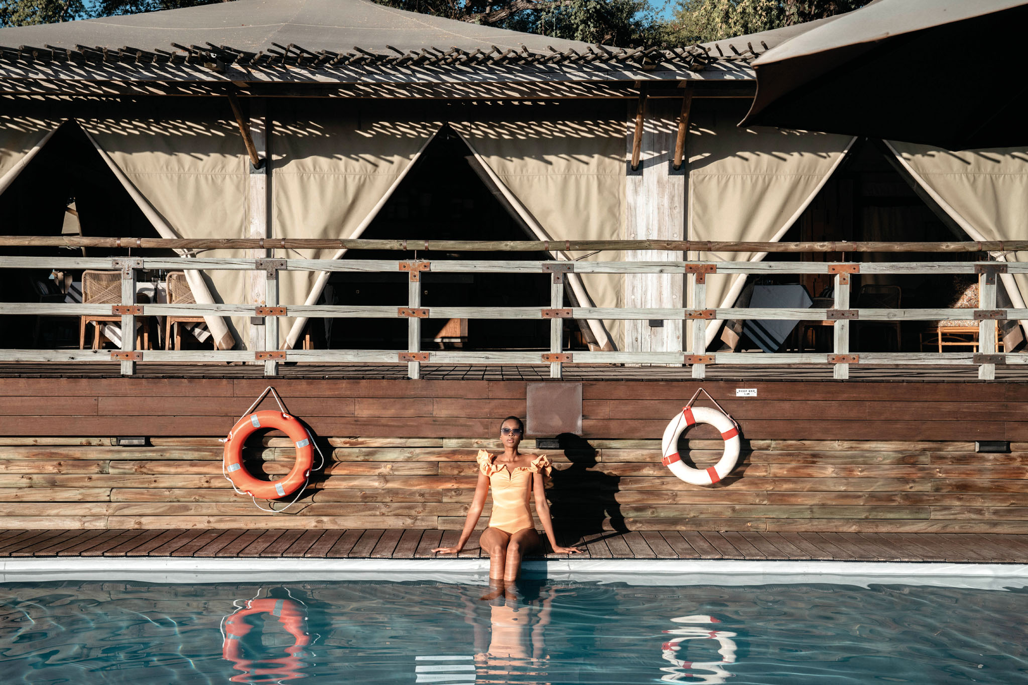 lady at pool of savute elephant lodge botswana