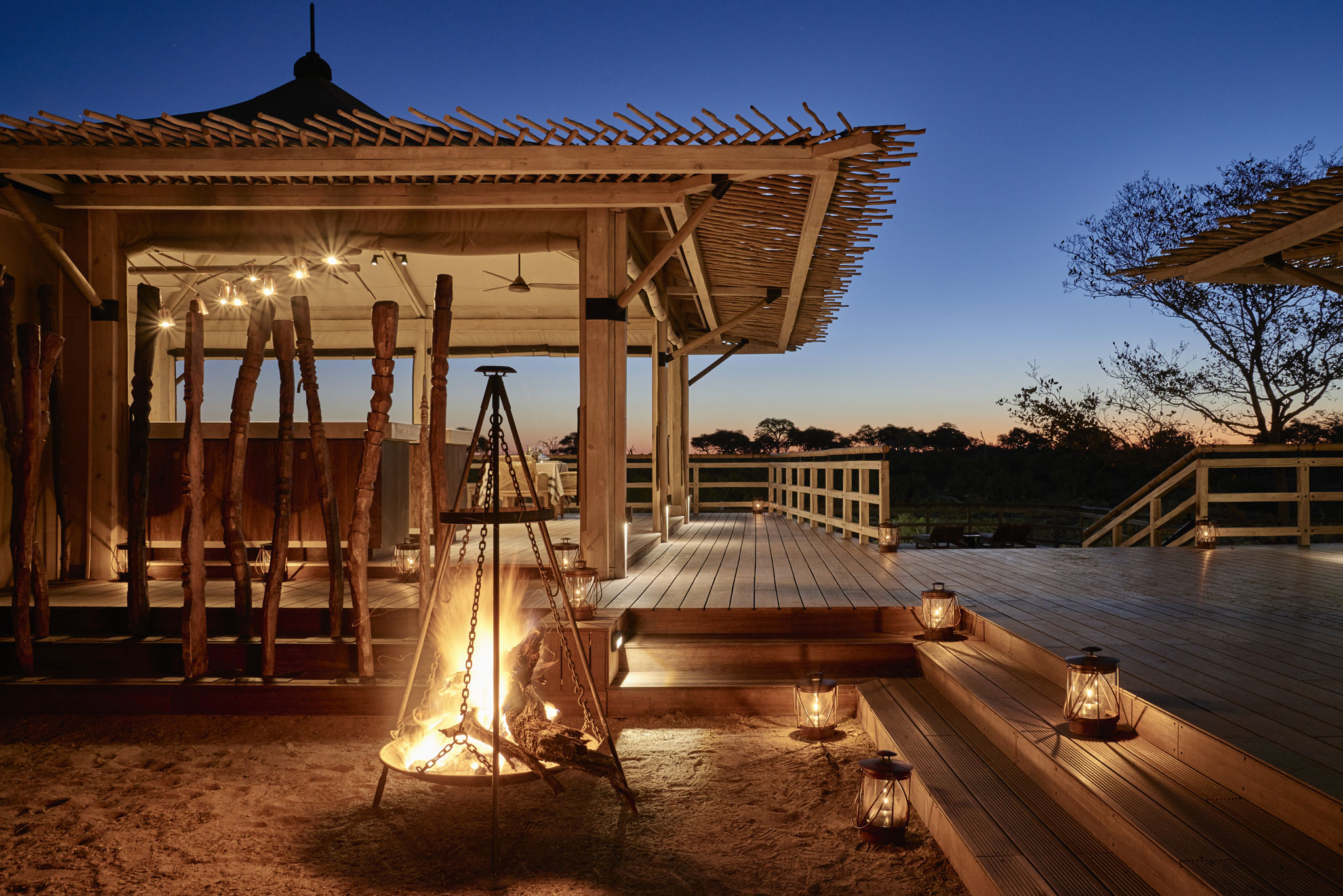 sunset view of fireplace with wooden deck in background Okavango delta Savute elephant lodge