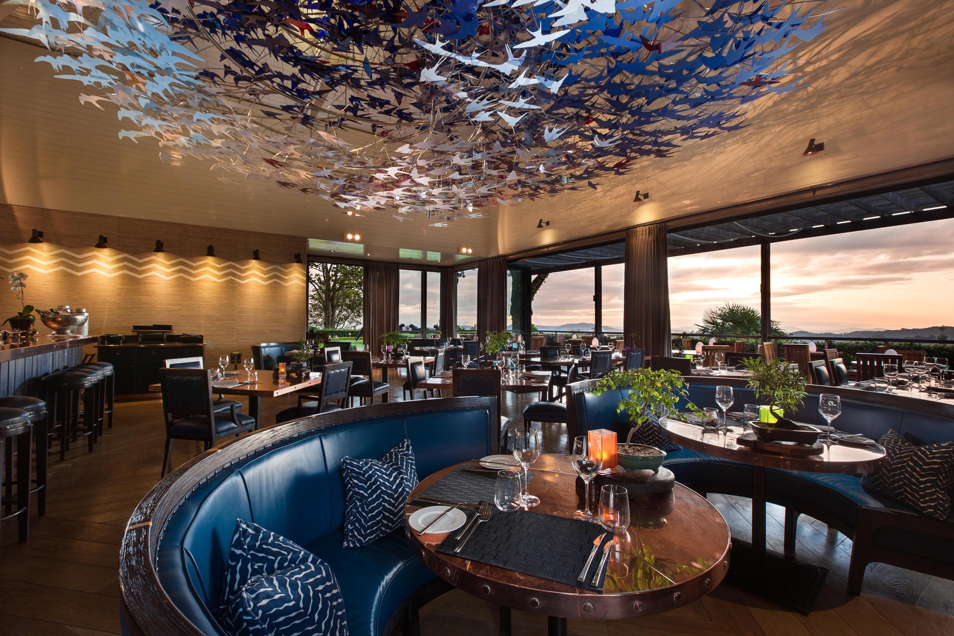 dining table with decorated hanging ceiling and great views at Delaire Graff luxury Wine estate in Franshoek