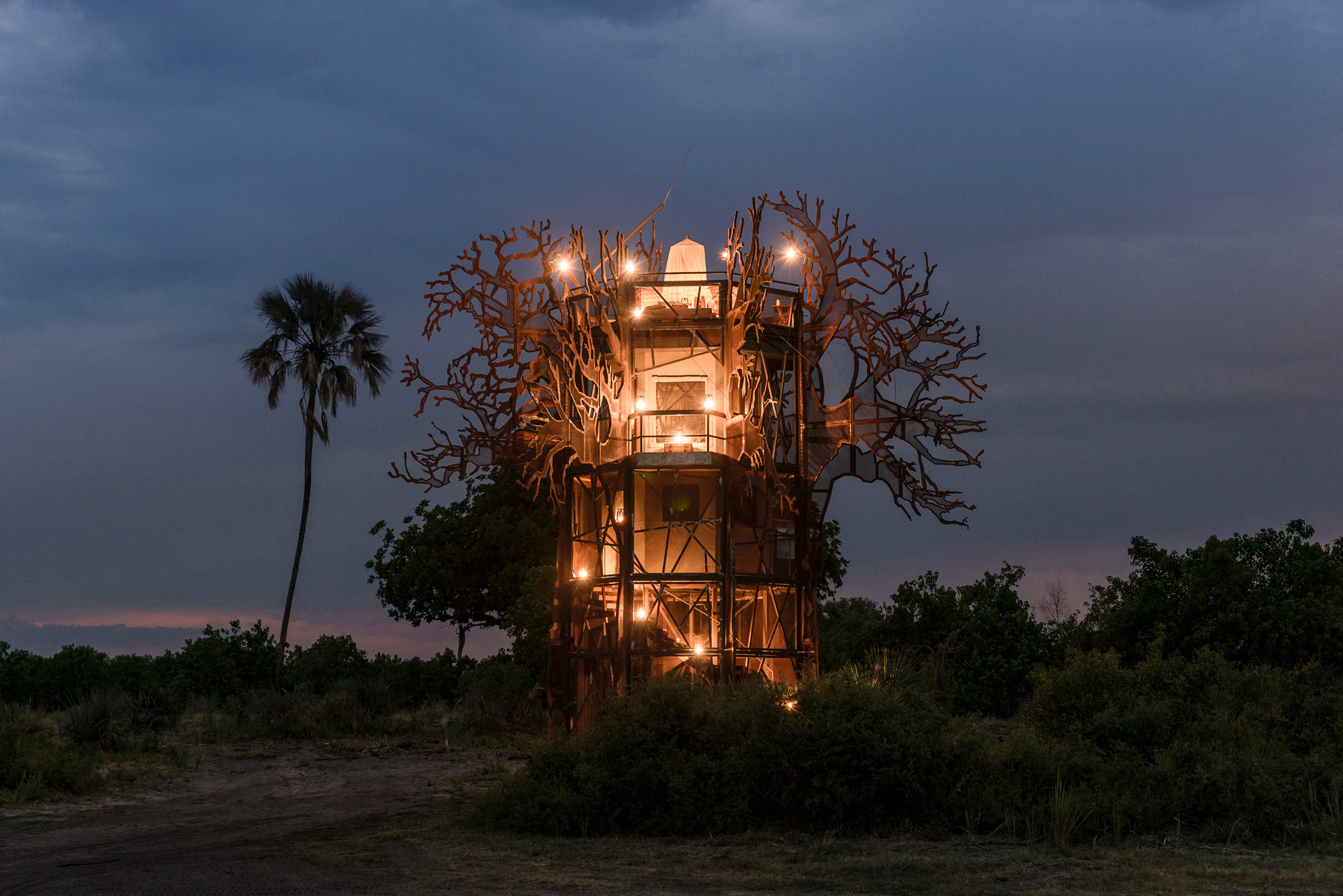 treehouse at night at xigera lodge