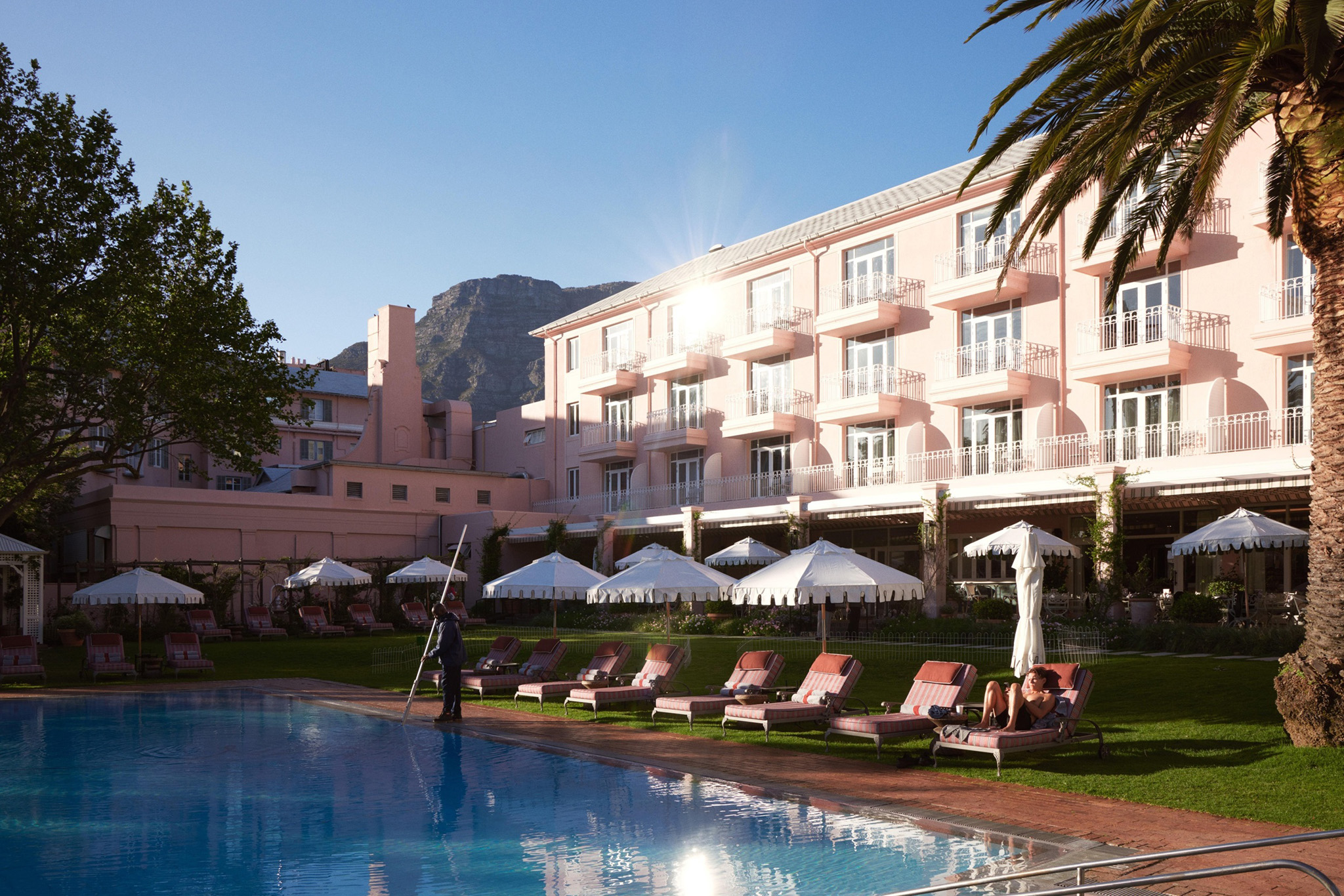 Pool Area with loungers and umbrellas at Mount Nelson Hotel Cape Town