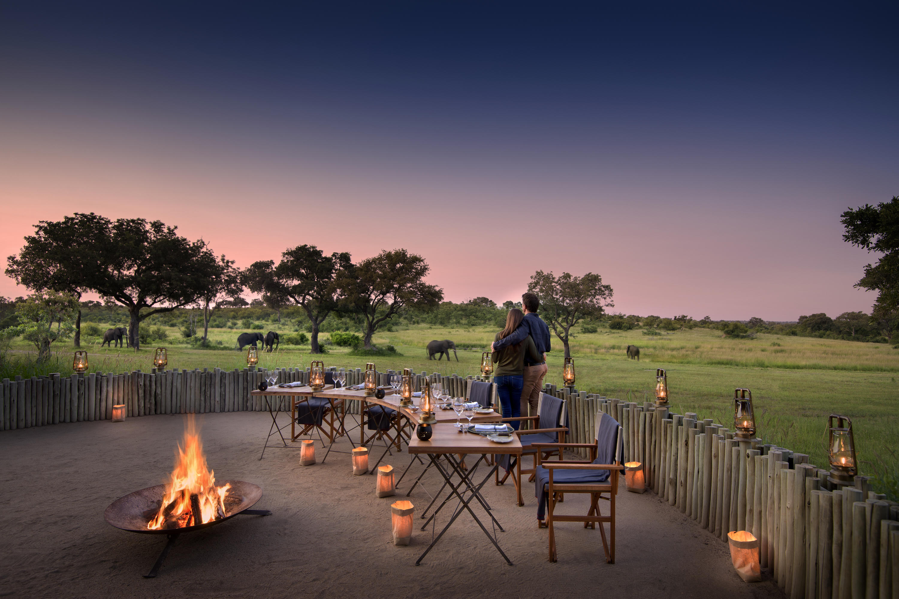 guests shaving sundowners in fireside boma of singita castleton