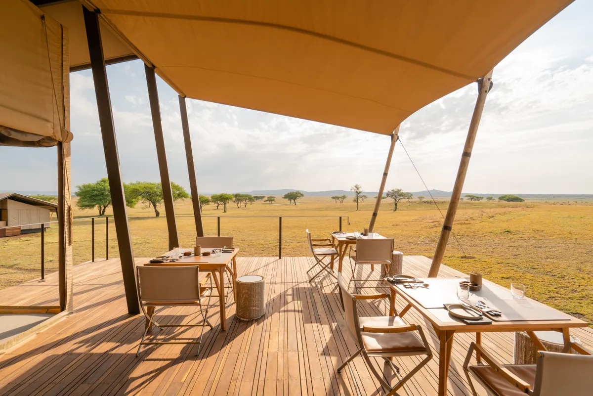 tables set on the deck of Singita Sabora Tented Camp Serengeti 