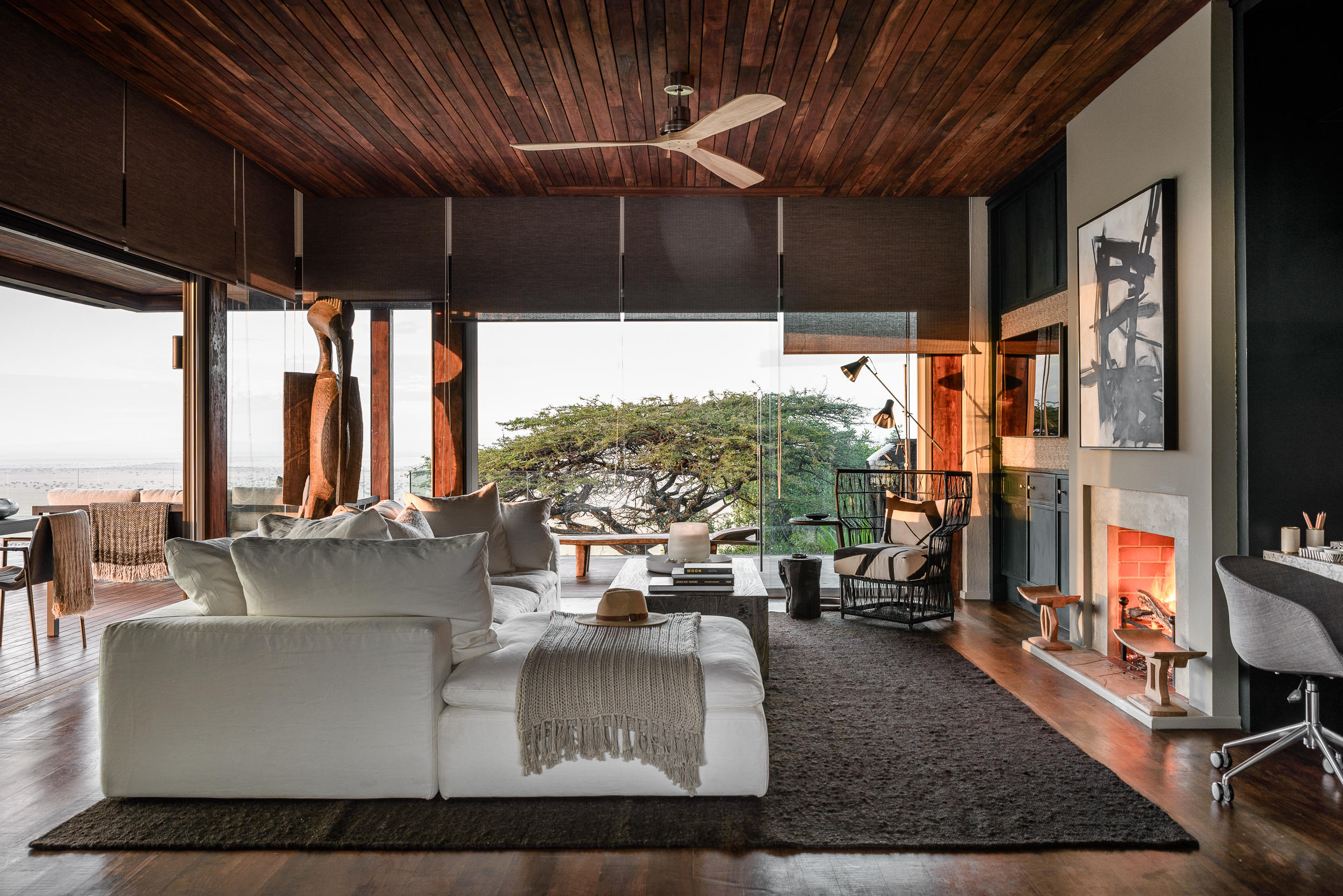 lounge and deck views of hillside suite at Singita Sasakwa lodge in Serengeti