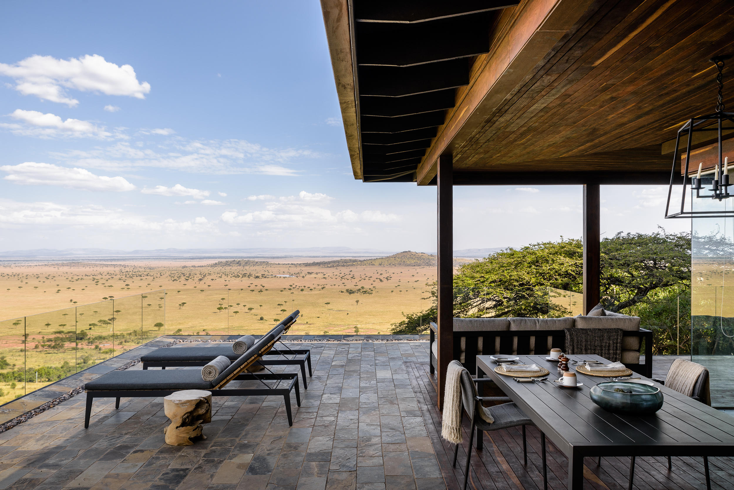 hillside suite deck with loungers at Singita Sasakwa lodge in Serengeti