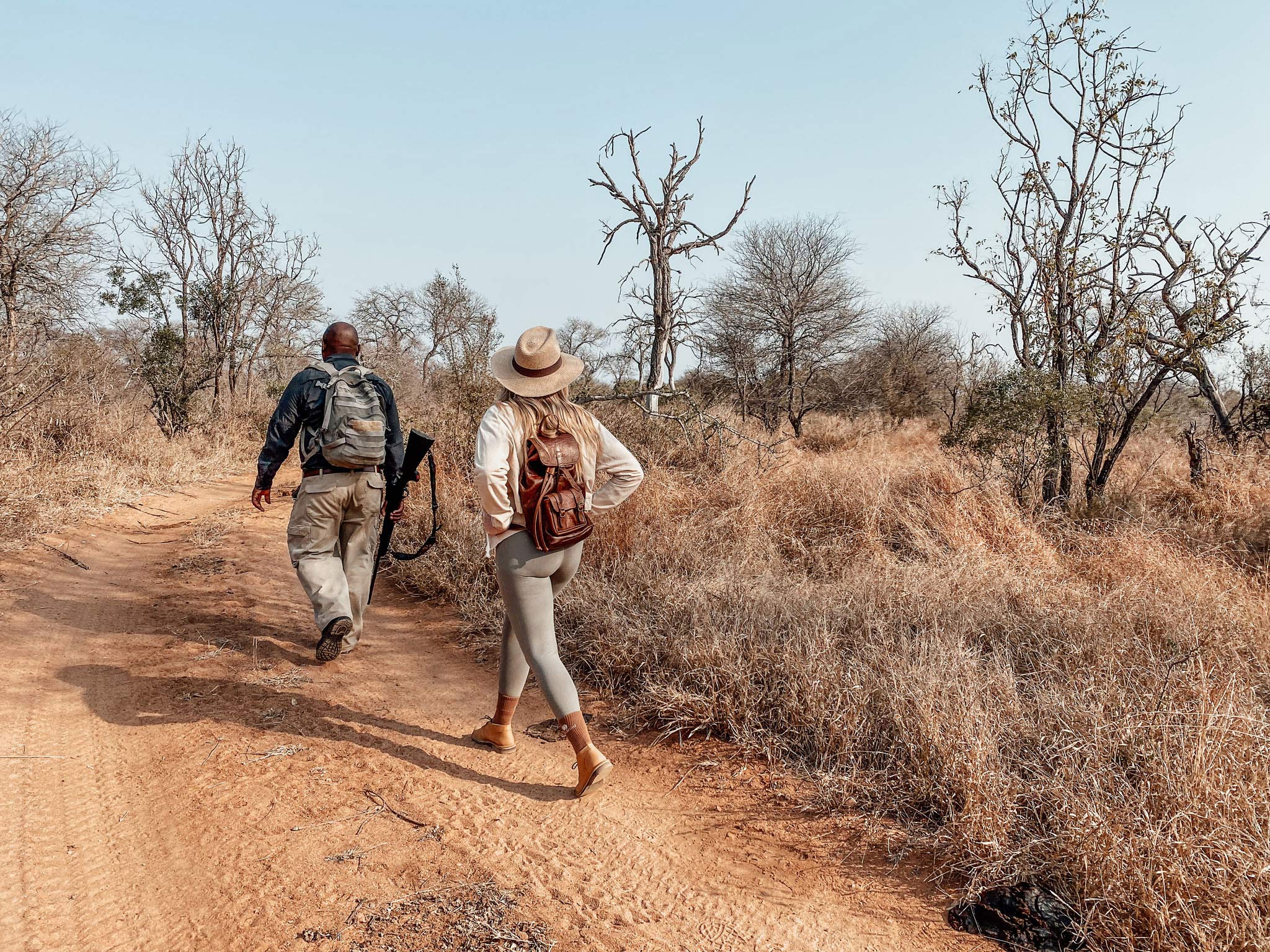 lady guest and guide going on a walking safari by Thornybush