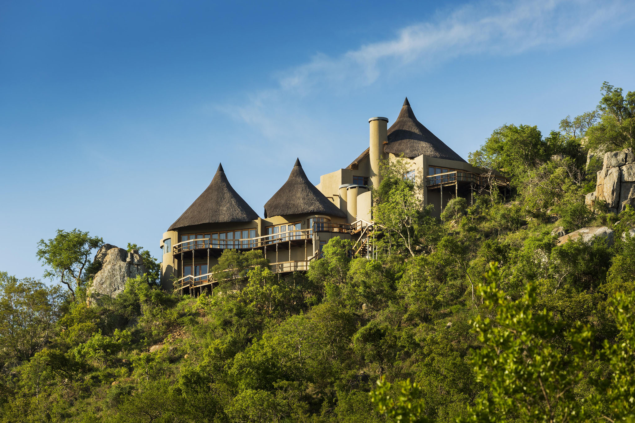 view of cliff lodge on rocky outcrop by ulusaba