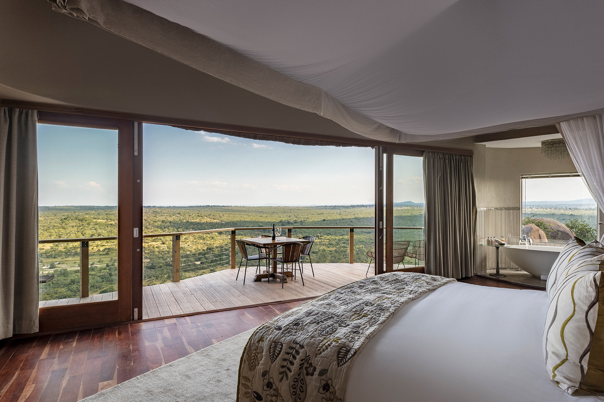 view from a luxury room with valley below at Ulusaba cliff lodge