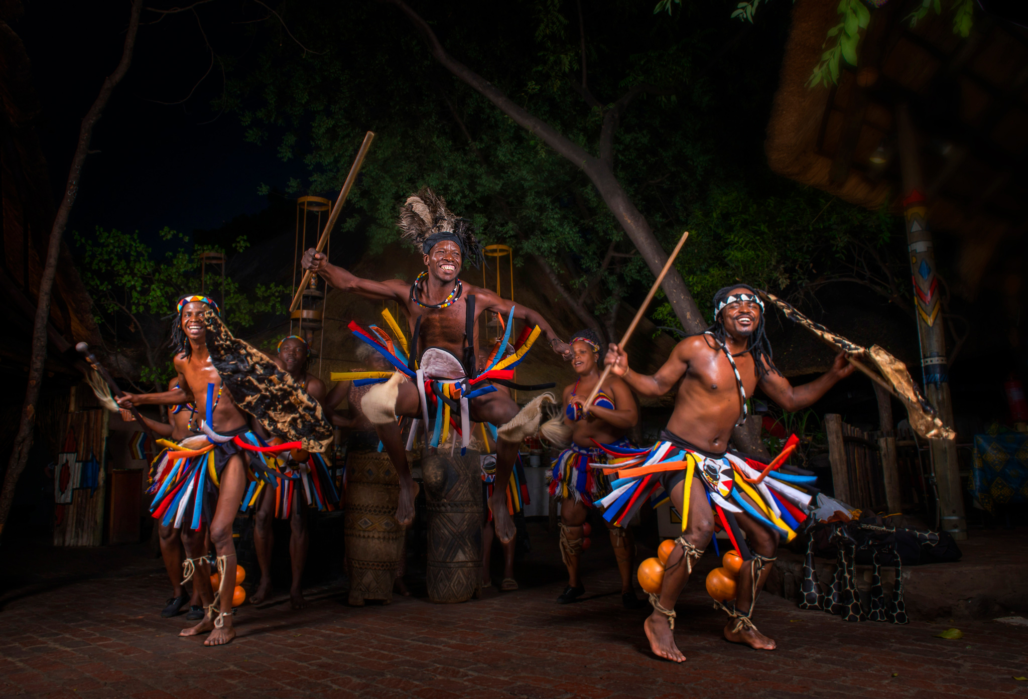 traditional African dancers entertaining guests at Victoria fall safari lodge Zimbabwe
