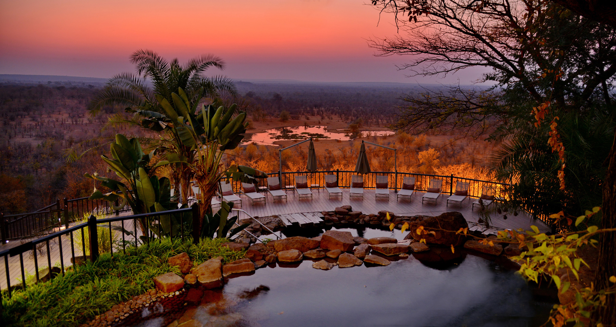 sunset view of the main pool deck of Victoria falls safari lodge