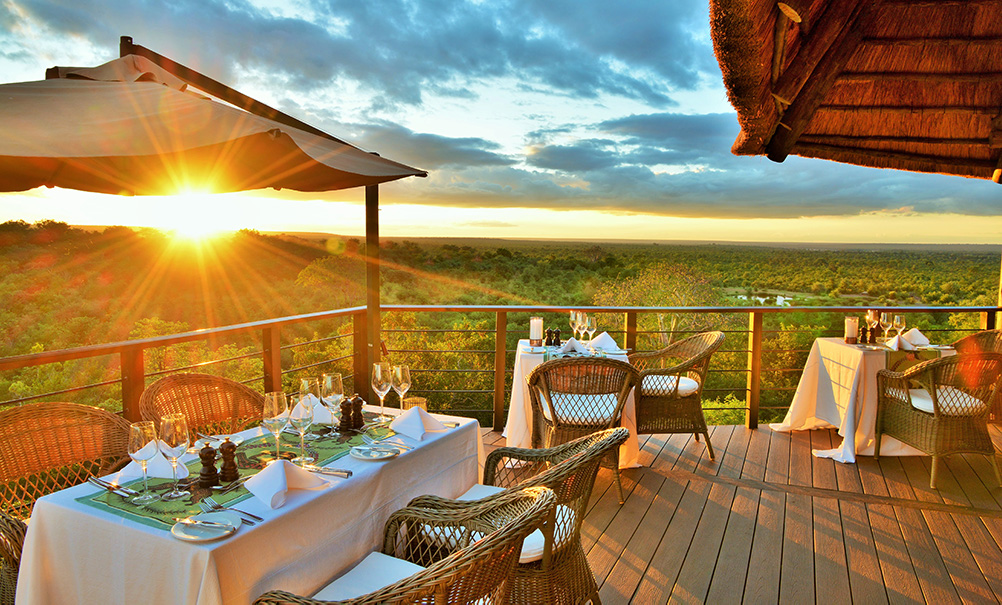 tables set on viewing deck for supper at victoria falls safari lodge