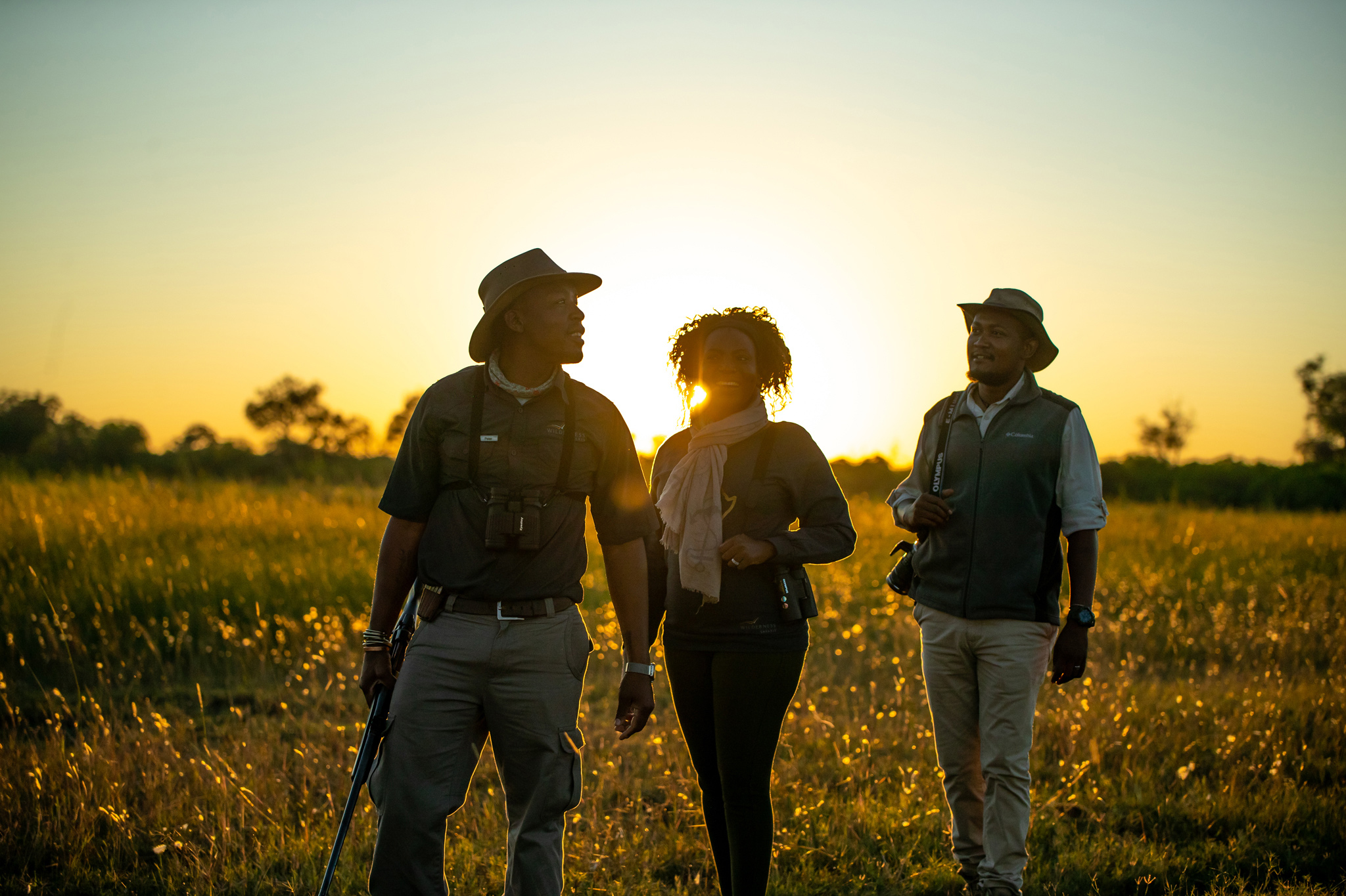 guests and guide on a walking safari by wilderness duma tau camp botswana