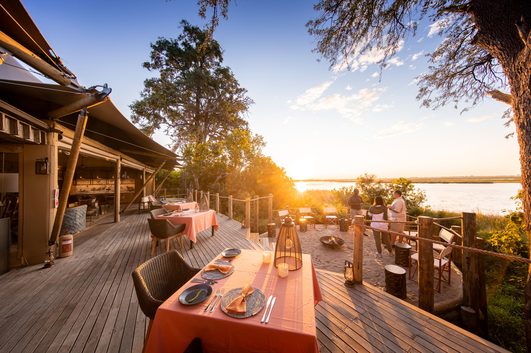 tables set on deck for dinner at at wilderness duma tau camp botswana