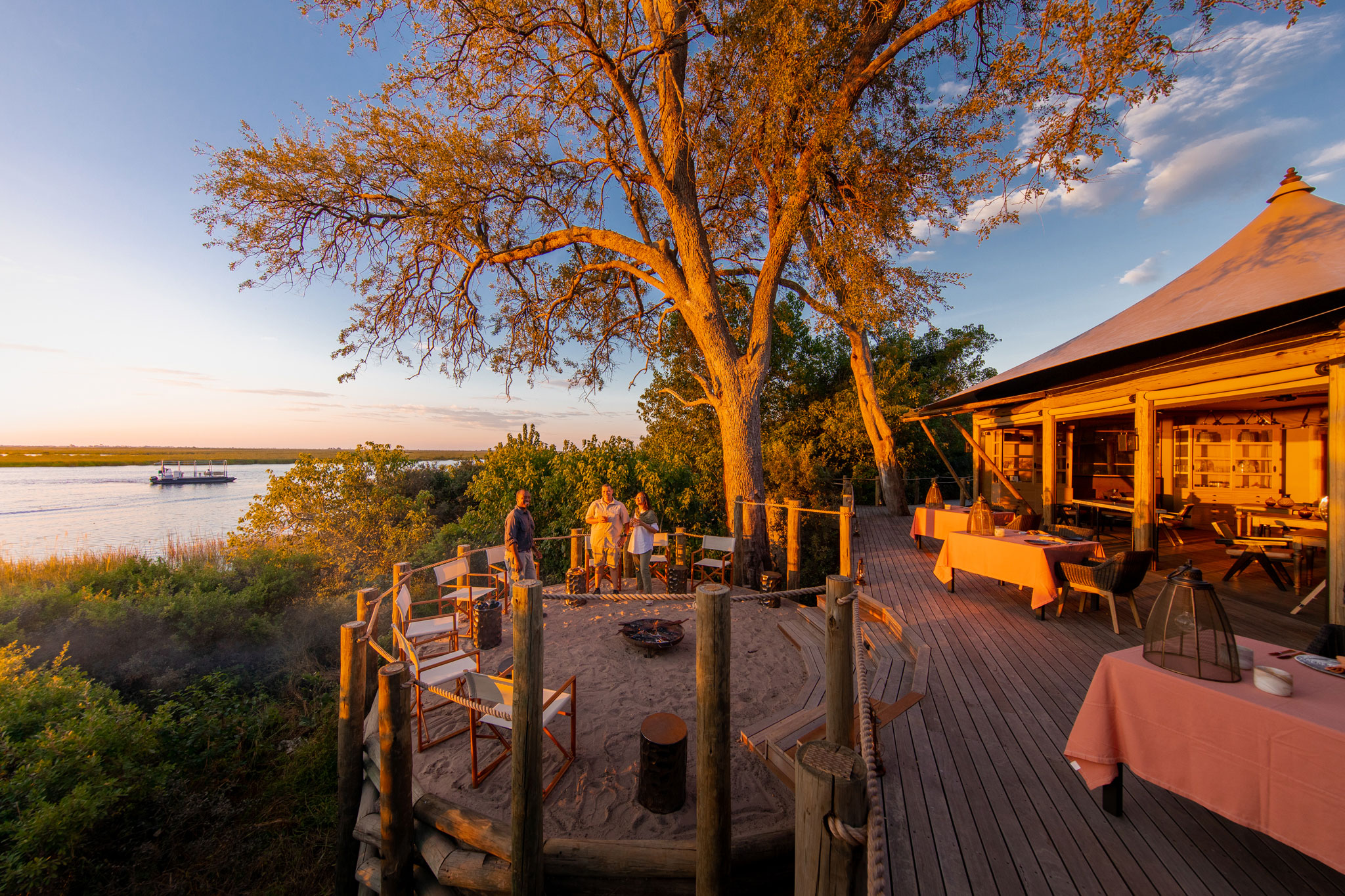 guests on deck of at wilderness duma tau camp botswana