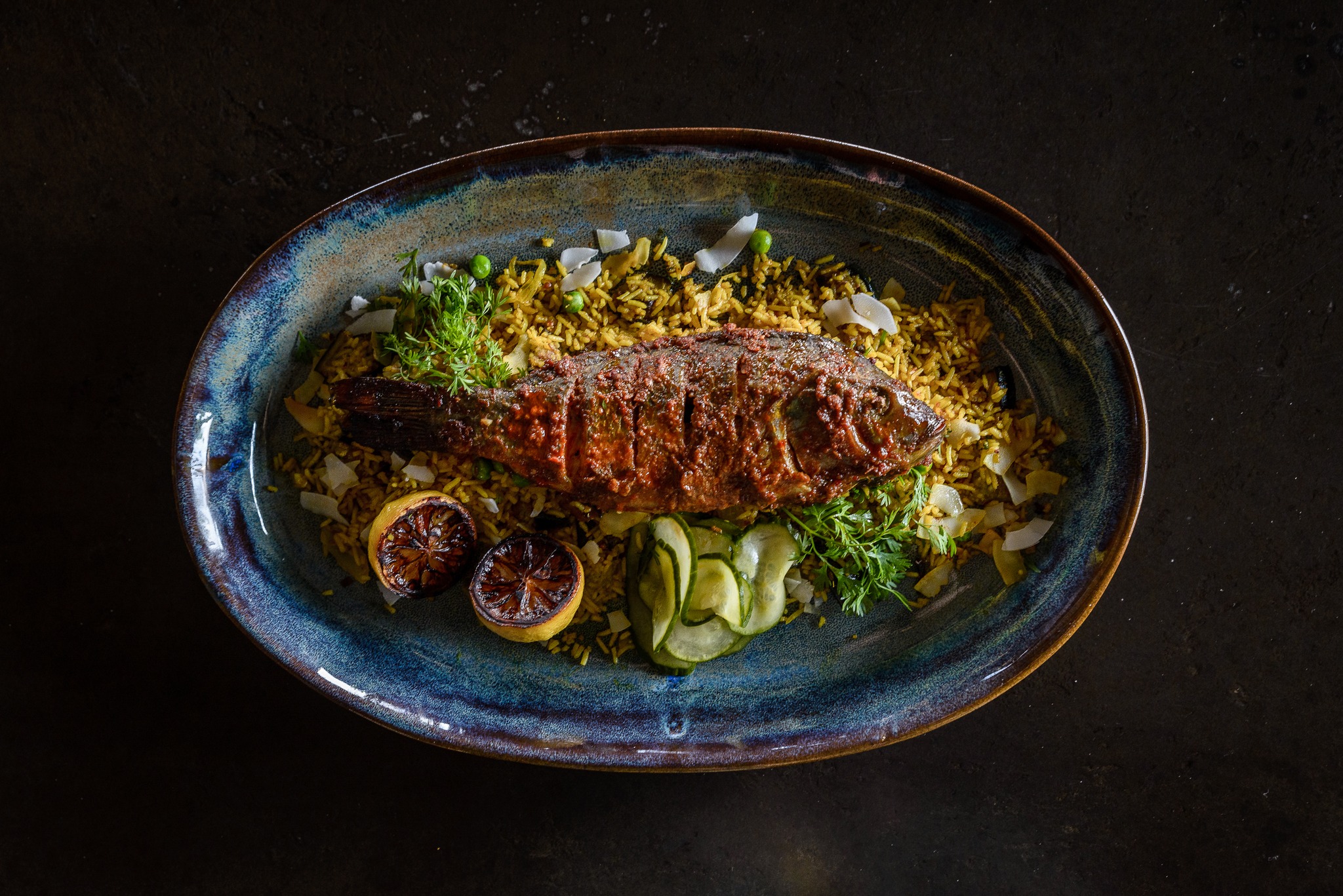 gourmet fish dish on plate at Xigera safari lodge Okavango Delta Bostwana